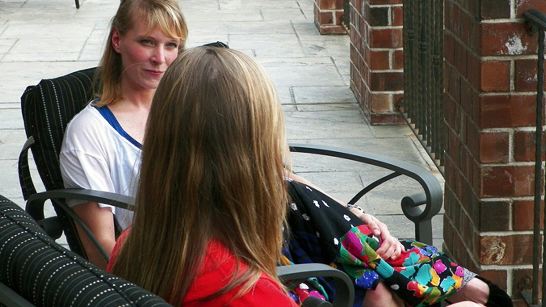 Castlewood Treatment Center therapist Kim Callaway, rear, speaks with Sara, a 22-year-old client at the center for eating disorders in St. Louis. Treatment centers are seeing a growing number of girls who are trying to achieve something known as thigh gap.