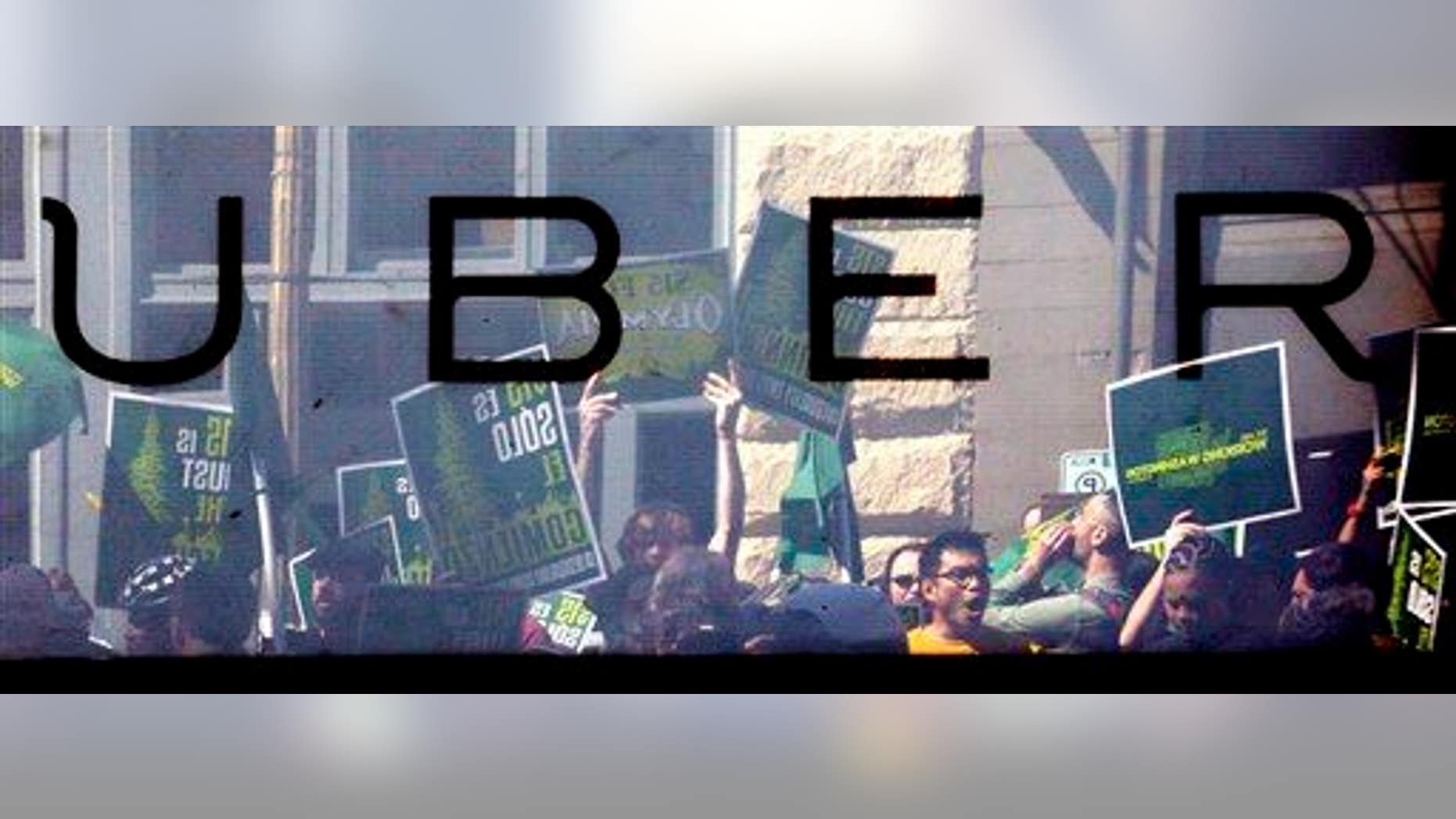 Protesters yelling at an Uber office are reflected in the window of the building at a rally for fair wages Wednesday, April 15, 2015, in Seattle. Across the U.S., low-wage workers are calling for protests for a $15 hourly wage in what organizers are calling the biggest mobilization of workers.