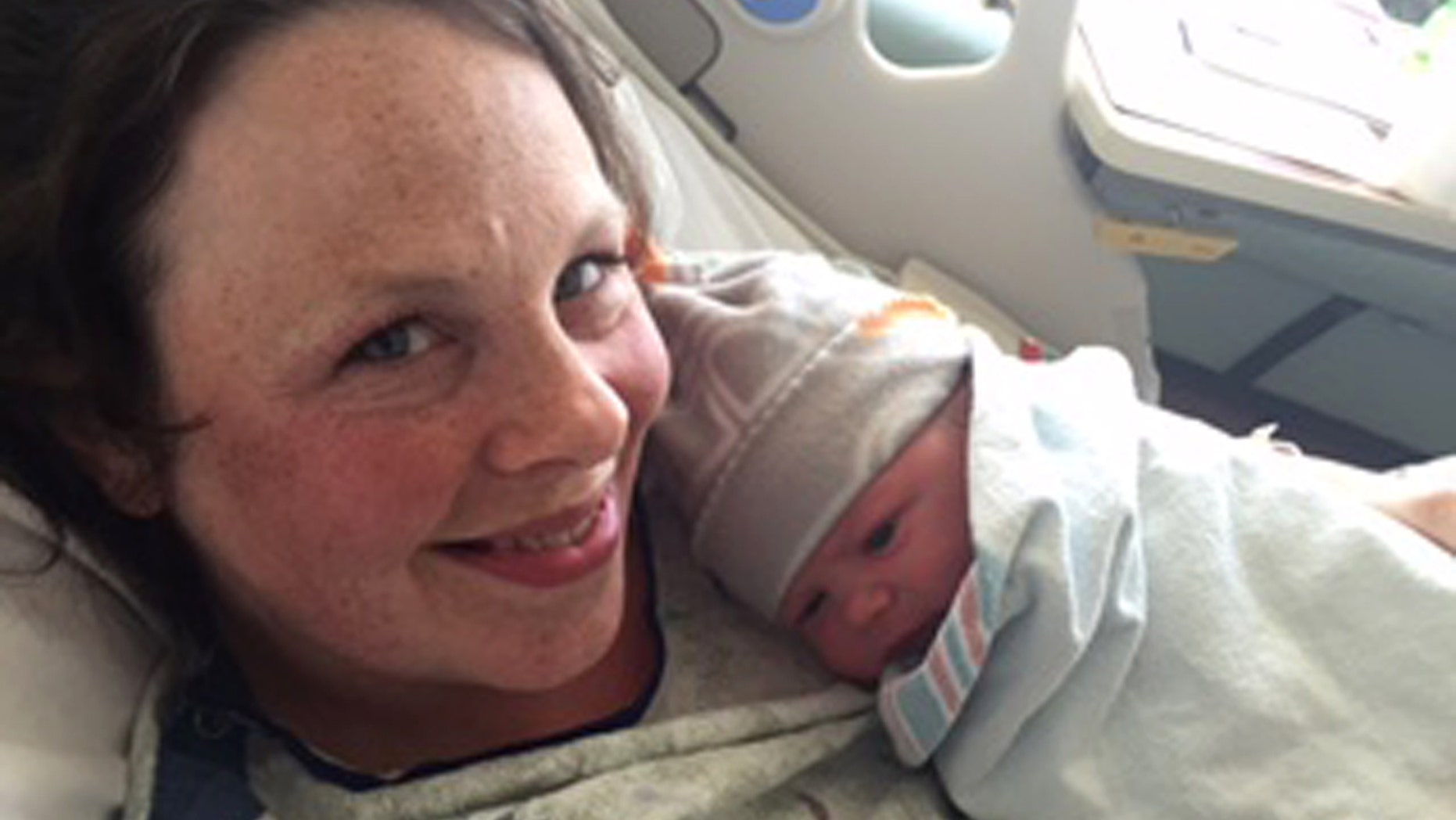 May 13, 2015: In this photo provided by Jay Schwandt, his wife, Kateri Schwandt holds her baby boy in Grand Rapids, Mich.