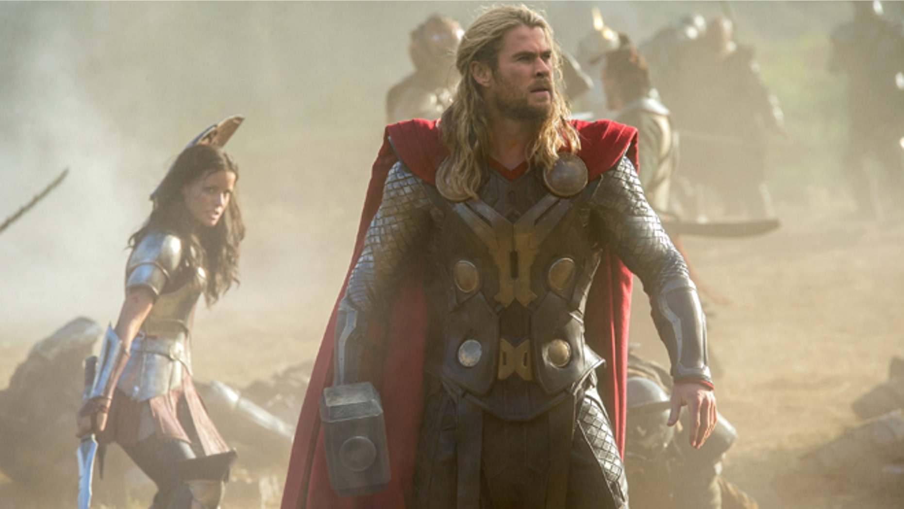 This publicity photo released by Walt Disney Studios and Marvel shows Jaimie Alexander, left, and Chris Hemsworth in a scene from "Thor: The Dark World."