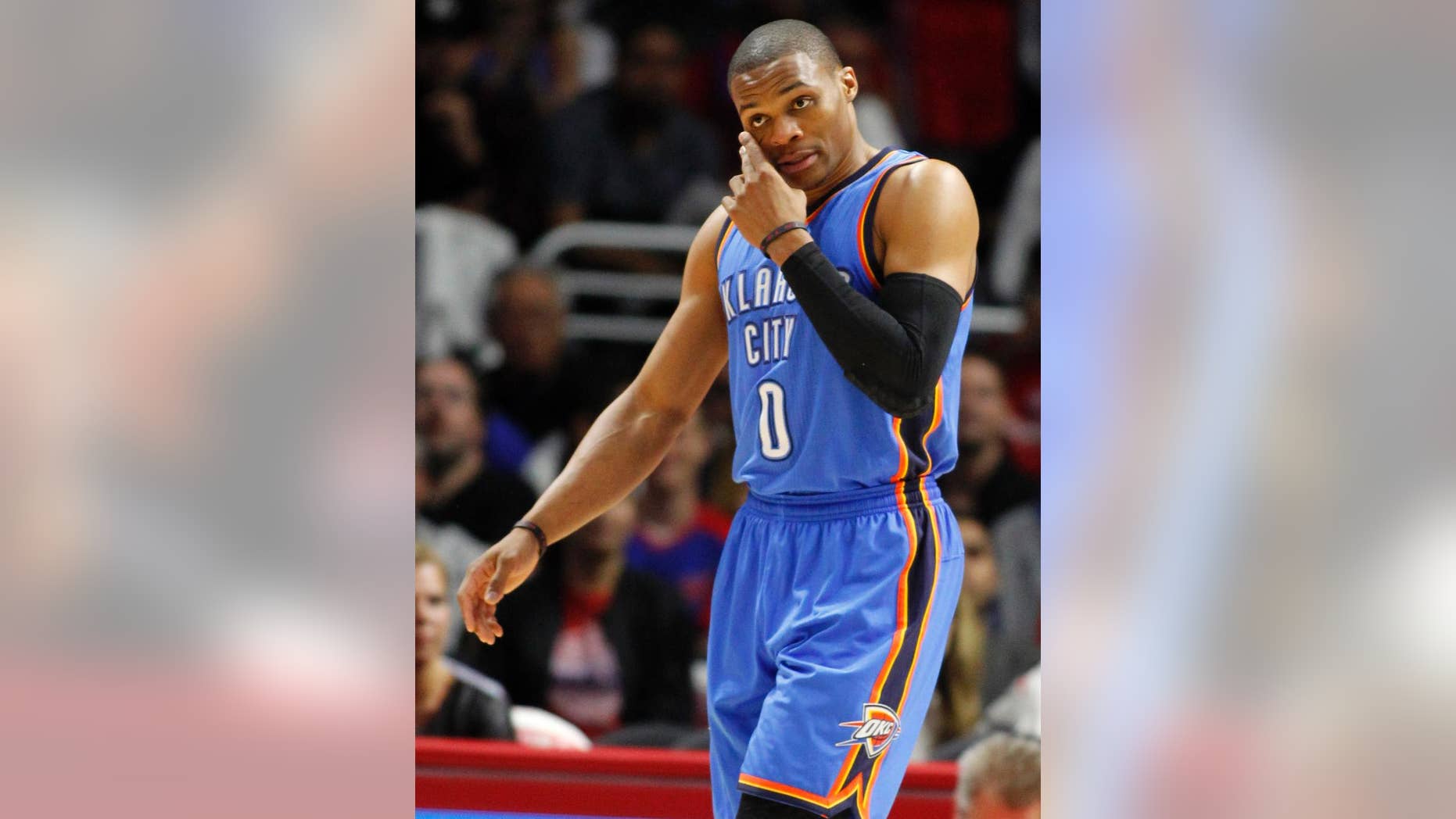 FILE - In this Oct. 30, 2014, file photo, Oklahoma City Thunder guard Russell Westbrook (0) wipes his face during the first half of an NBA basketball game against the Los Angeles Clippers in Los Angeles. (AP Photo/Alex Gallardo, File(
