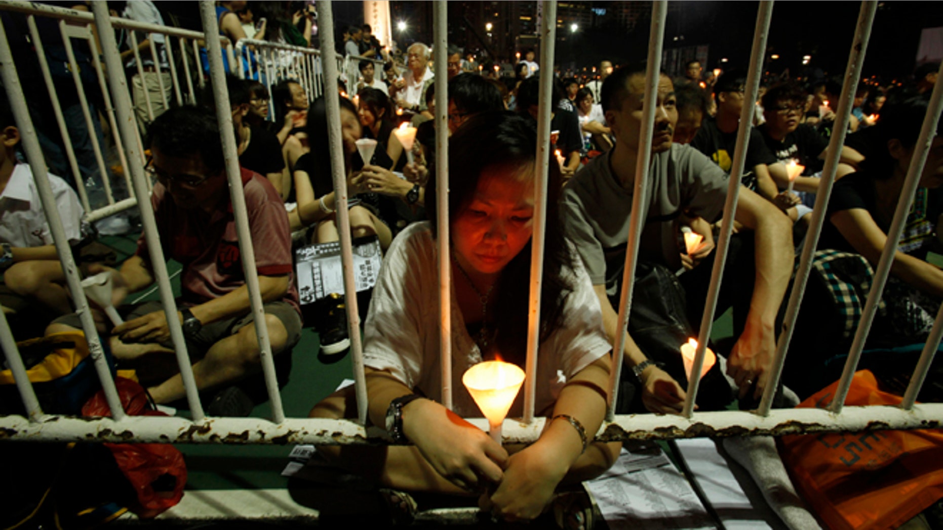 June 4, 2013: Protesters participate in a candlelight vigil at Hong Kong's Victoria Park to mourn those who died in a military crackdown on pro-democracy movement at Beijing's Tiananmen Square in 1989. Tuesday marks the 24th anniversary of the military crackdown of the movement