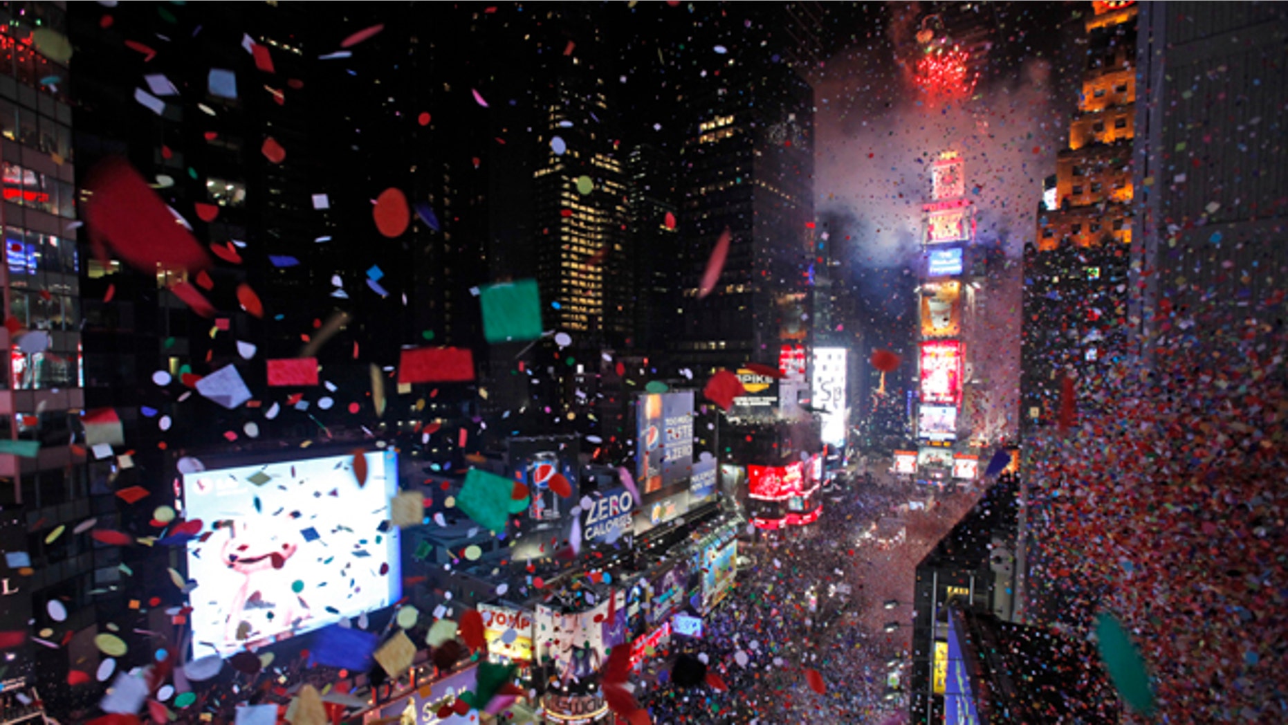 Confetti is seen flying over New York's Times Square from the balcony of the Marriott Marquis hotel when the clock struck midnight during the New Year's Eve celebration, Friday, Dec. 31, 2010. (AP Photo/Mary Altaffer)