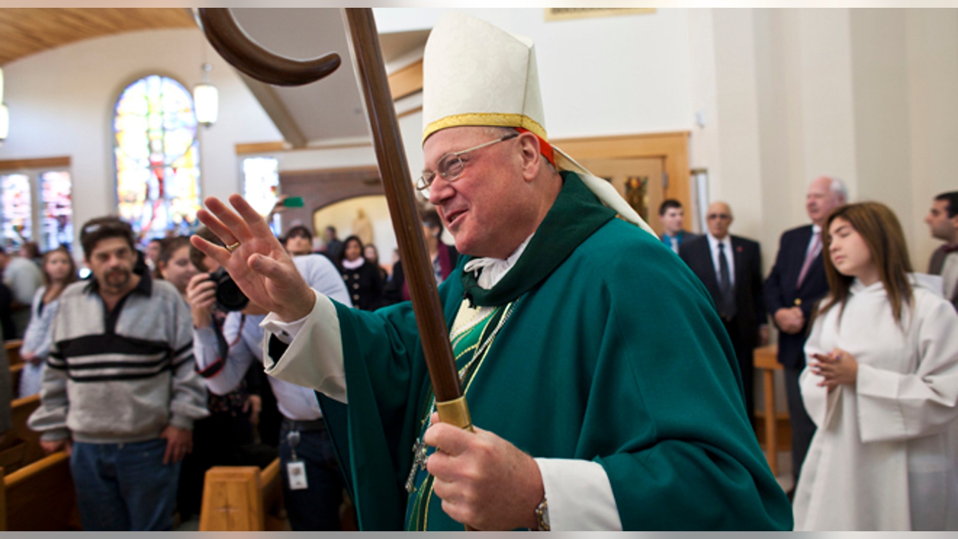 NEW YORK, NY - OCTOBER 27: Cardinal Timothy Dolan during a procession to celebrate a Mass of Remembrance marking the first anniversary of Hurricane Sandy at Our Lady Star of the Sea church on October 27, 2013 in Staten Island borough of New York City. Hurricane Sandy made landfall on October 29, 2012 near Brigantine, New Jersey and affected 24 states from Florida to Maine and cost the country an estimated $65 billion. (Photo by Ramin Talaie/Getty Images)