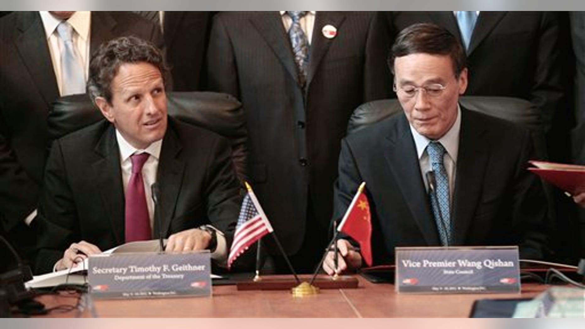 May 10: Treasury Secretary Timothy Geithner and Chinese Vice Premier Wang Qishan take part in a signing ceremony in the Cash Room of the Treasury Department during the US-China Strategic and Economic Dialogue meetings in Washington.