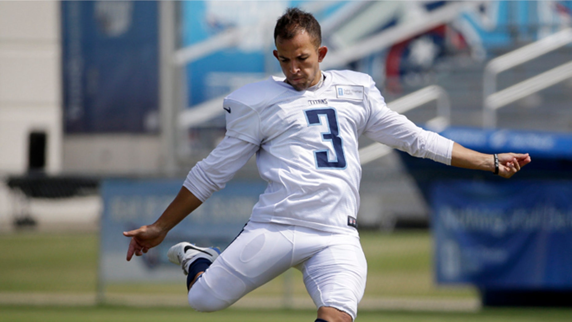 FILE -- In this July 31, 2014 file photo, Tennessee Titans kicker Maikon Bonani practices during NFL football training camp Thursday, July 31, 2014, in Nashville, Tenn. Bonani fell 35 feet from a theme park gondola in an accident that left him with broken vertebra in his back and cost him a season at South Florida. Now the native of Brazil is in Tennessee for a second training camp and competing to be the Titans' new kicker. (AP Photo/Mark Humphrey, File)