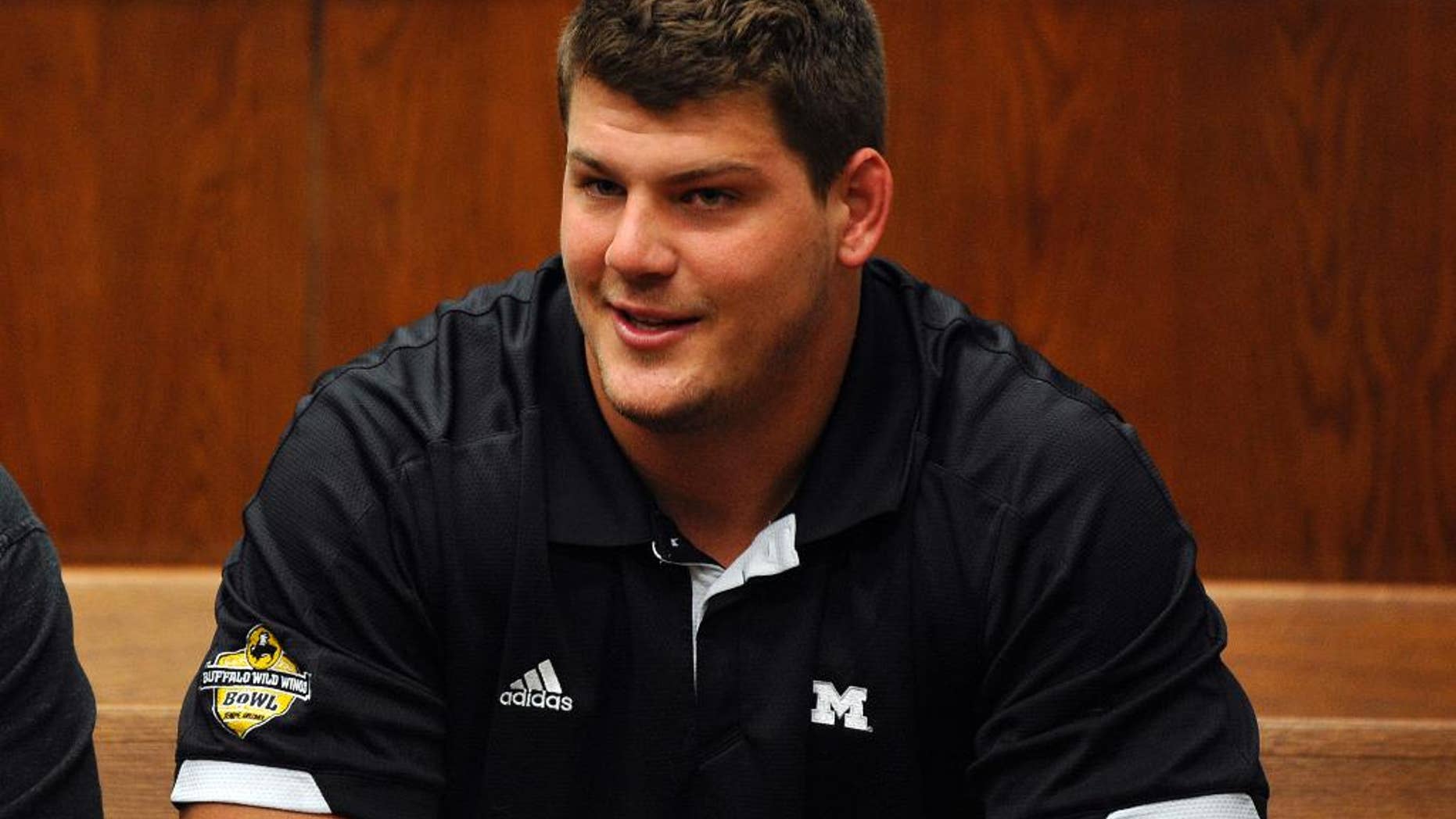 Tennessee Titans rookie NFL football player Taylor Lewan sits in Washtenaw County District Court in Ann Arbor, Mich., where he plead guilty to two misdemeanors to resolve an assualt case involving an Ohio State fan, Thursday, Oct. 30, 2014. (AP Photo/The Detroit News, Charles V. Tines) DETROIT FREE PRESS OUT. HUFFINGTON POST OUT