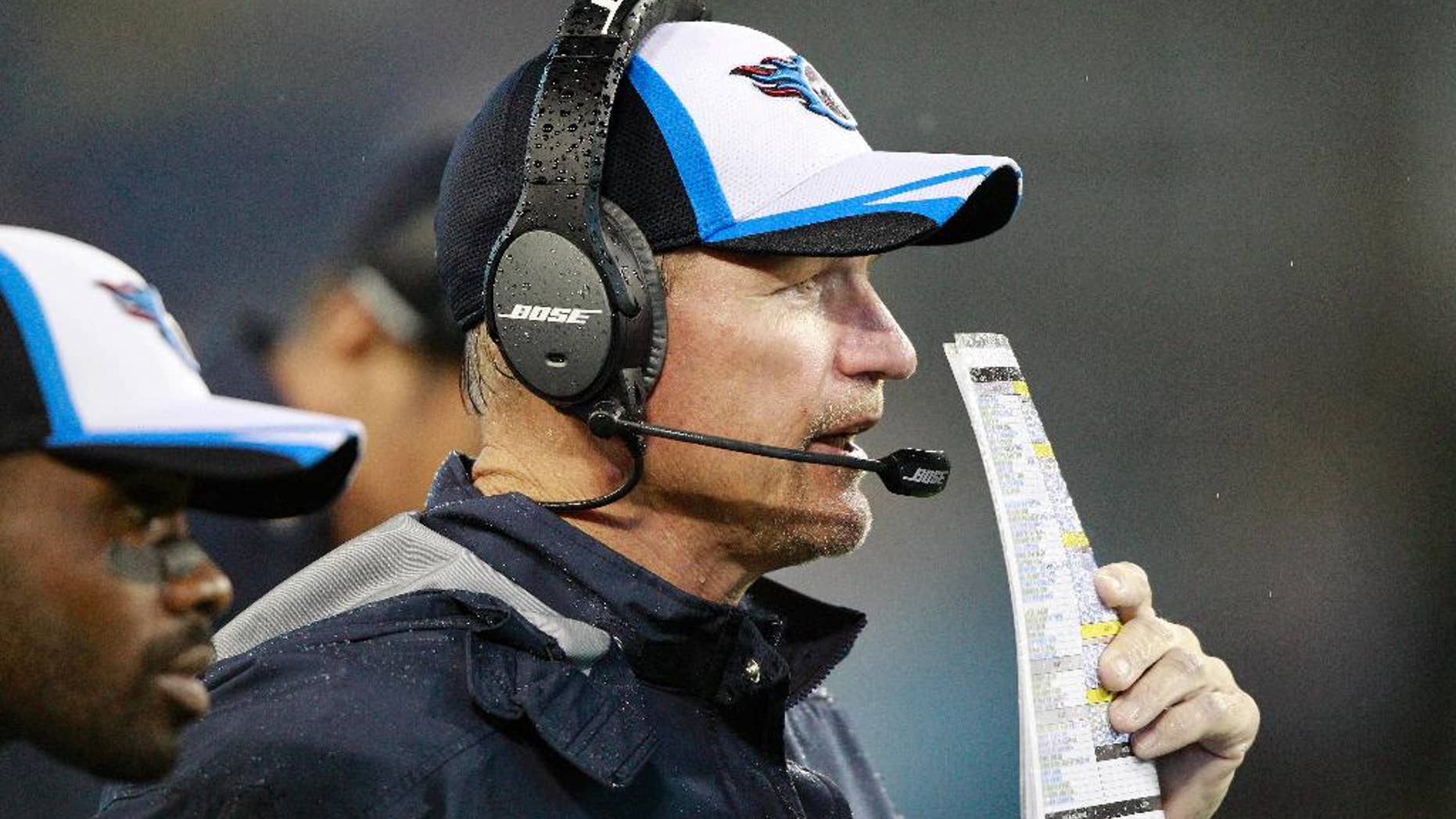 FILE - In this Aug. 9, 2014, file photo, Tennessee Titans head coach Ken Whisenhunt watches the action during his first game as the Titans' head coach against the Green Bay Packers in a preseason NFL football game in Nashville, Tenn. Whisenhunt has been a much needed breath of fresh air for the Titans, snapping them out of routines and holding them accountable for mistakes. (AP Photo/Wade Payne, File)