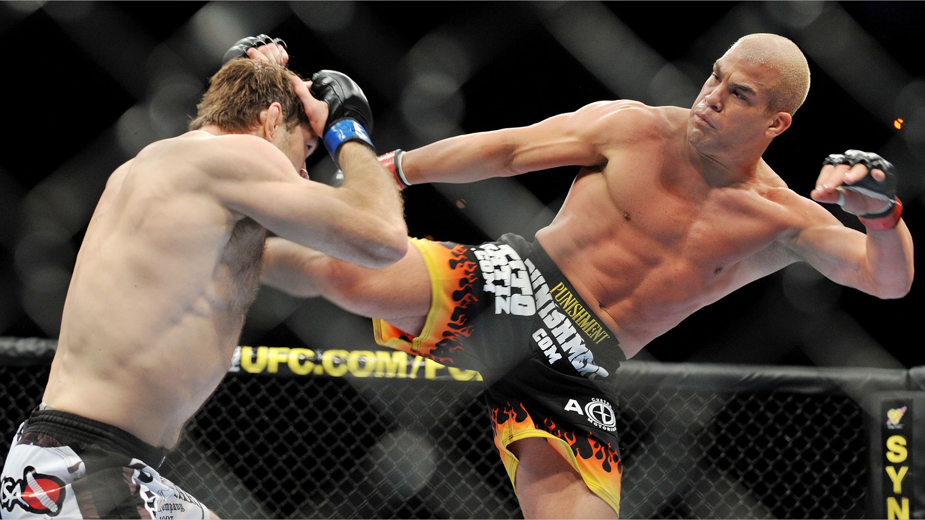 Tito Ortiz (R) battles Forrest Griffin during their Light Heavyweight Fight at the UFC 106 in 2009 in Las Vegas, Nevada.