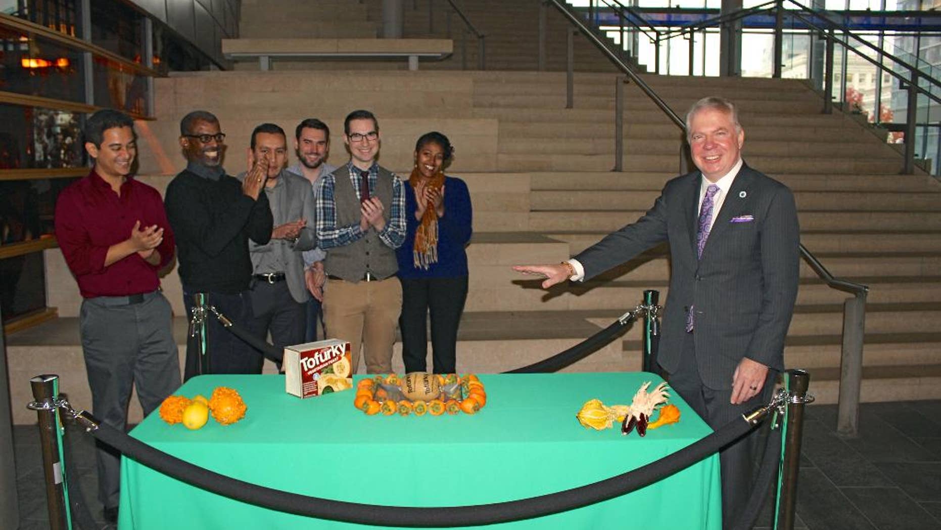 In this Nov. 21, 2014 photo provided by the office of Seattle Mayor Ed Murray, Murray poses for a photo as he "pardons" a Tofurky, a soy-based turkey alternative, at Seattle City Hall. The ceremony was a twist on the traditional presidential turkey pardon. (AP Photo/ Seattle Mayor's Office)