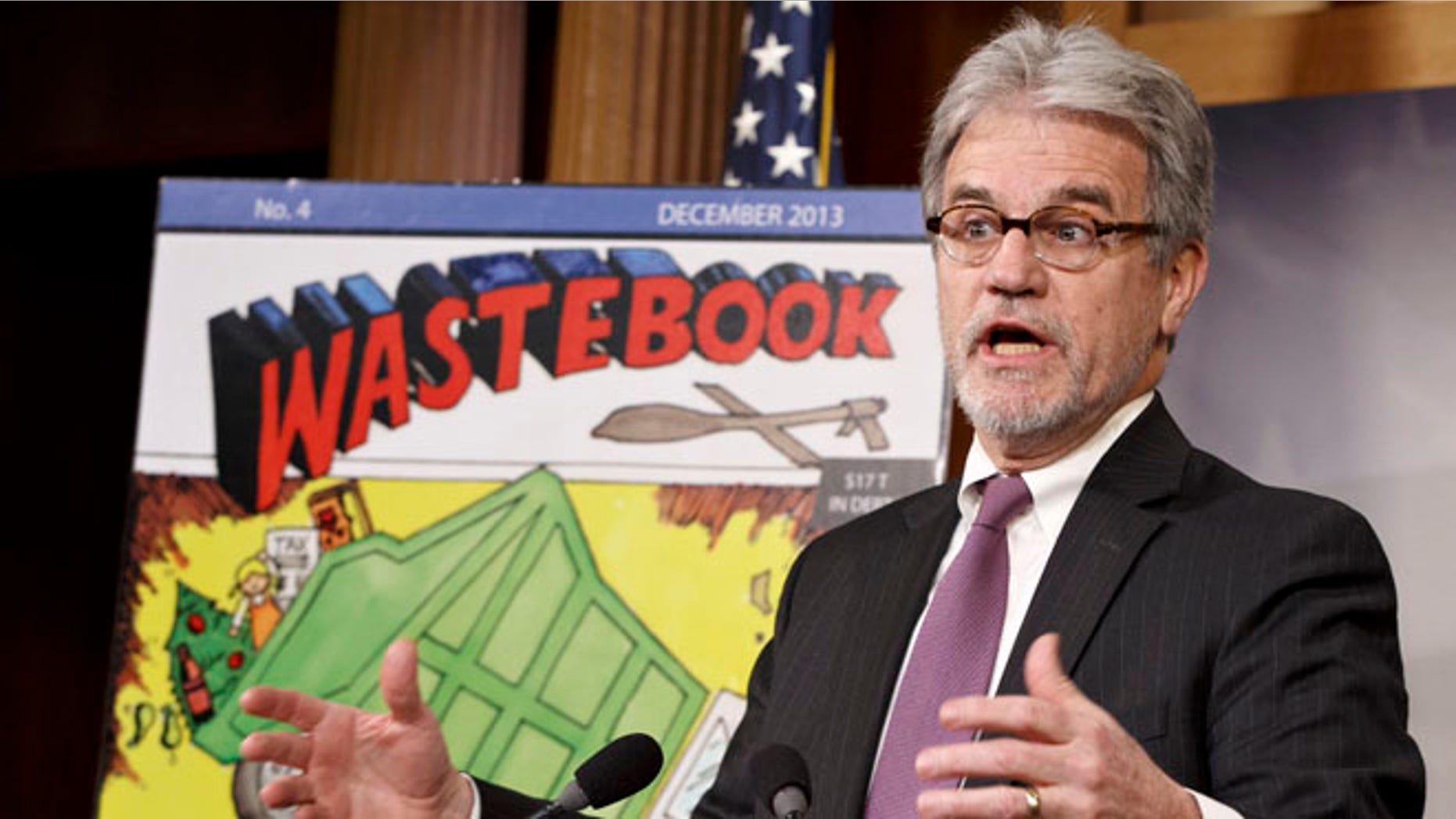 Dec. 17, 2013 file photo, Sen. Tom Coburn, R-Okla., outlines his annual “Wastebook,” which points a critical finger at billions of dollars in questionable government spending during a news conference on Capitol Hill in Washington.