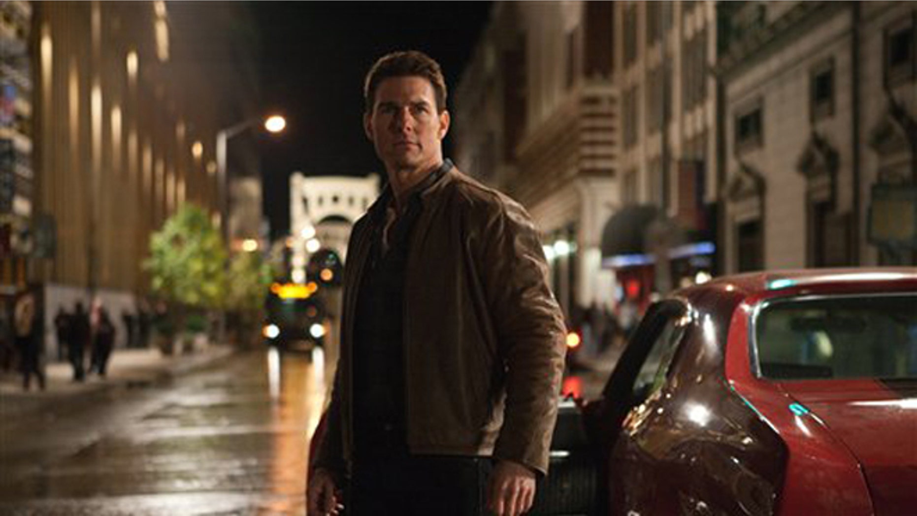 In this publicity photo provided by Paramount Pictures, actor Tom Cruise, center, is Jack Reacher in film, "Jack Reacher," from Paramount Pictures and Skydance Productions.