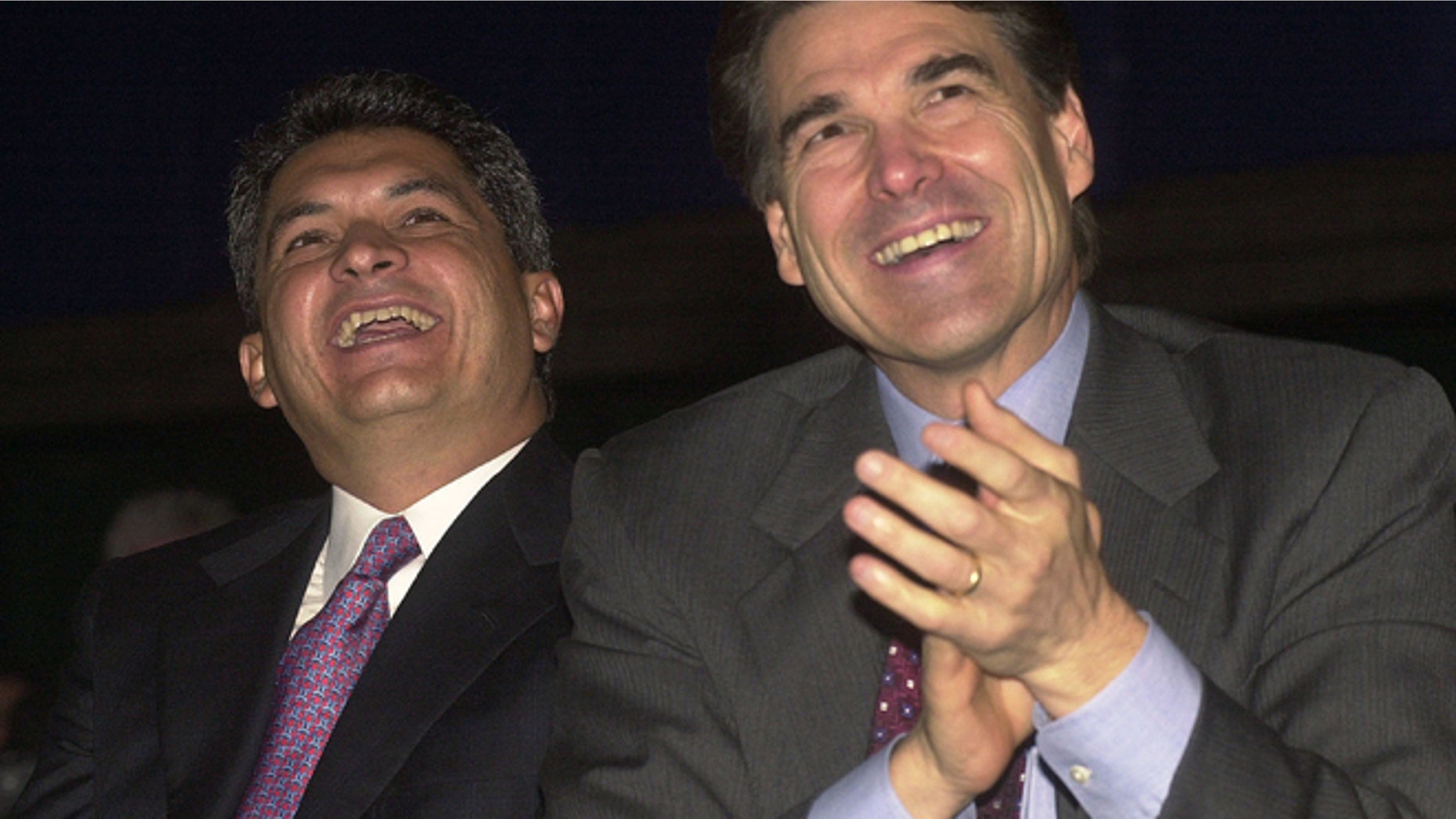 August, 22, 2001: Governor Tomas Yarrington (L) of the state of Tamaulipas, Mexico, and Texas Governor Rick Perry listen to remarks during the U.S. and Mexico Border Summit in Edinburg, TX. (Photo by Alicia Wagner Calzada/Getty Images)