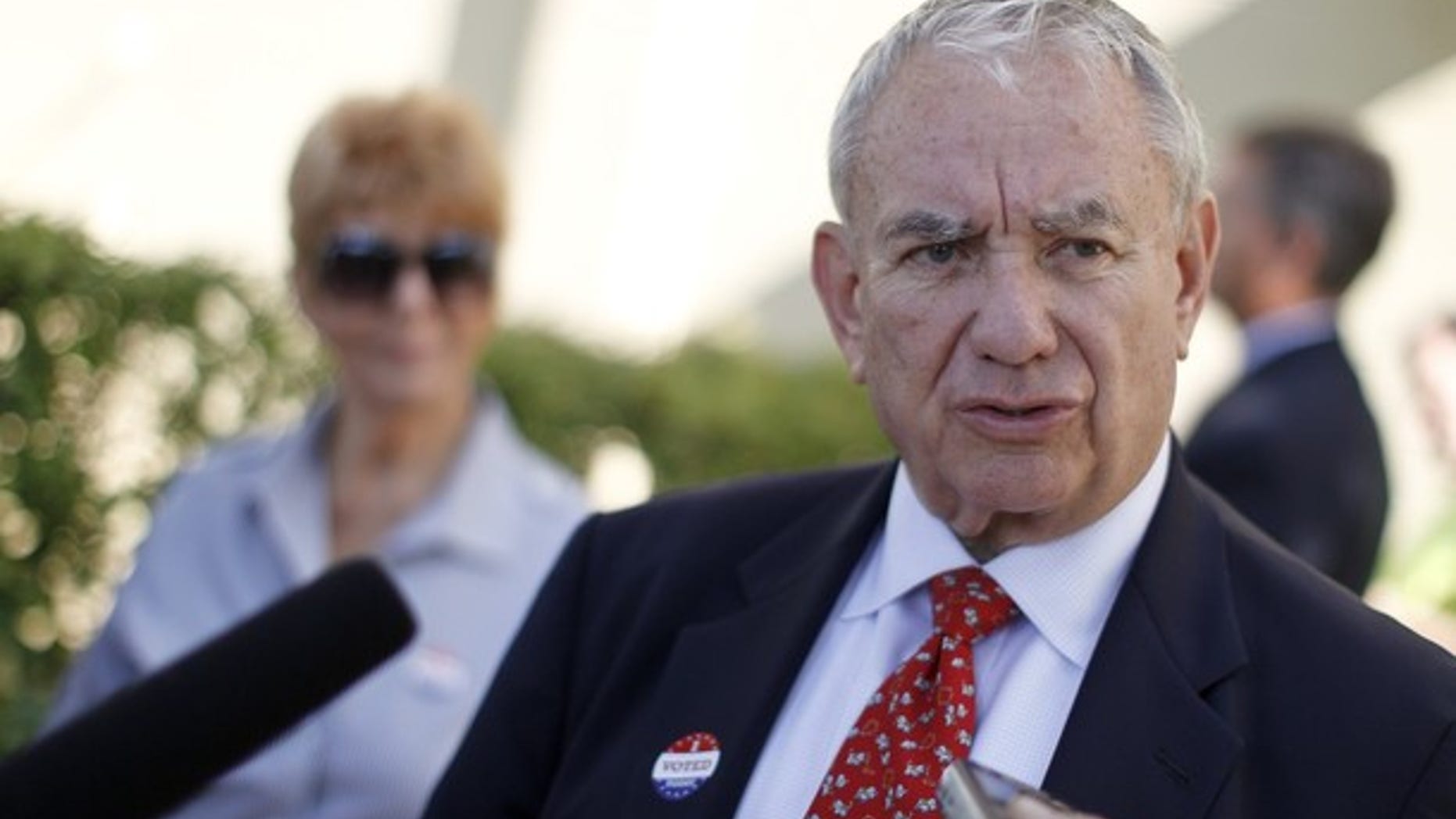 Aug. 14, 2012: Former Wisconsin Gov. Tommy Thompson talks to the media after voting in a primary election.
