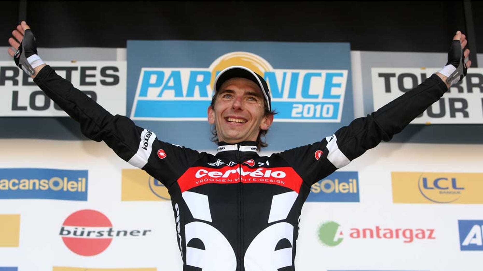 FILE - This March 13, 2010, file photo shows Xavier Tondo, of Spain, celebrating on the podium after winning the sixth stage of the Paris-Nice cycling race in Tourrettes sur Loup, southeastern France. Tondo, 32, died in a freak accident Monday, May 23, 2011, after he was crushed between his car and a garage door in southern Spain, a Civil Guard spokesman said. (AP Photo/Lionel Cironneau)