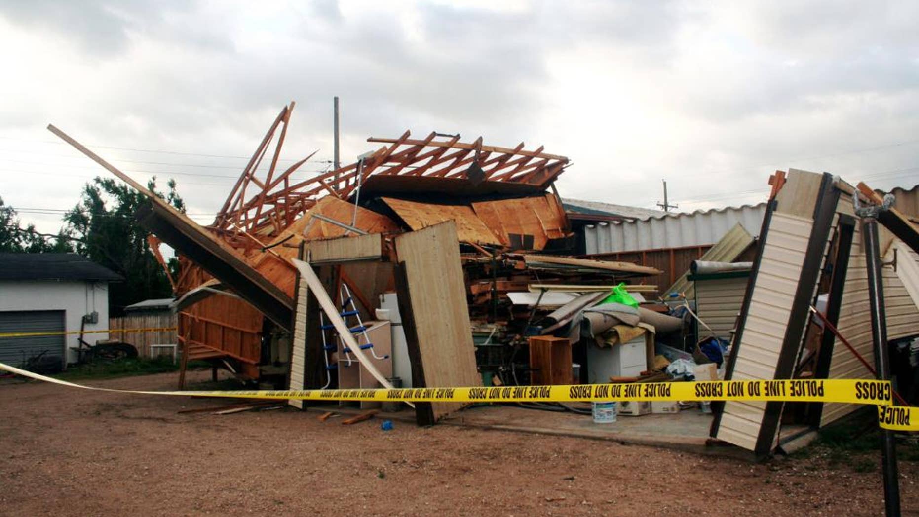 FILE - In this May 31, 2007, file photo, a structure is destroyed after a tornado briefly touched down in Guymon, Okla. The National Weather Service in Norman has used Twitter and Facebook for years to disseminate weather warnings. But they tried a new approach recently, holding an online “tornado drill.” (AP Photo/Guymon Daily Herald, Heather Avey, File)