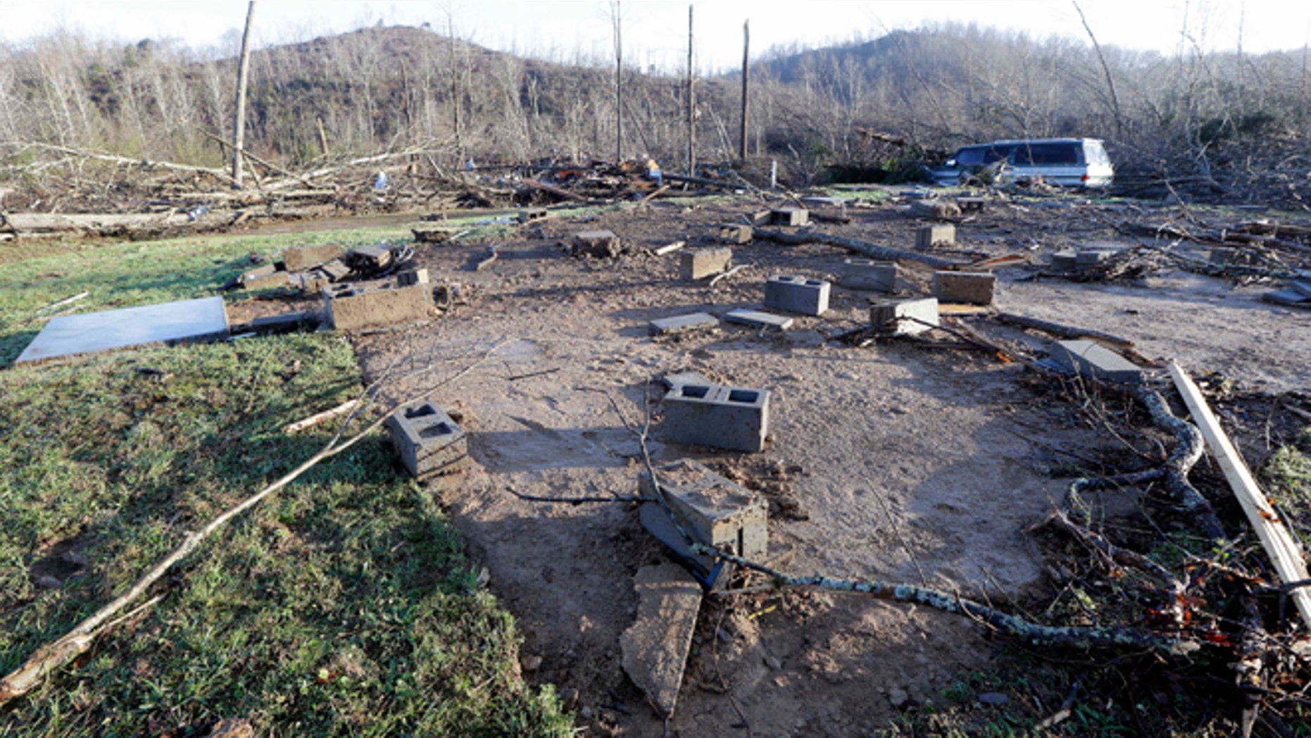 Concrete blocks from the foundation of the home of Antonio Yzaguirre, and his wife, Ann Yzaguirre, show where the house once stood, Thursday, Dec. 24, 2015, after severe storms went through the area Wednesday night near Linden, Tenn. The couple was killed in the storm. (AP Photo/Mark Humphrey)