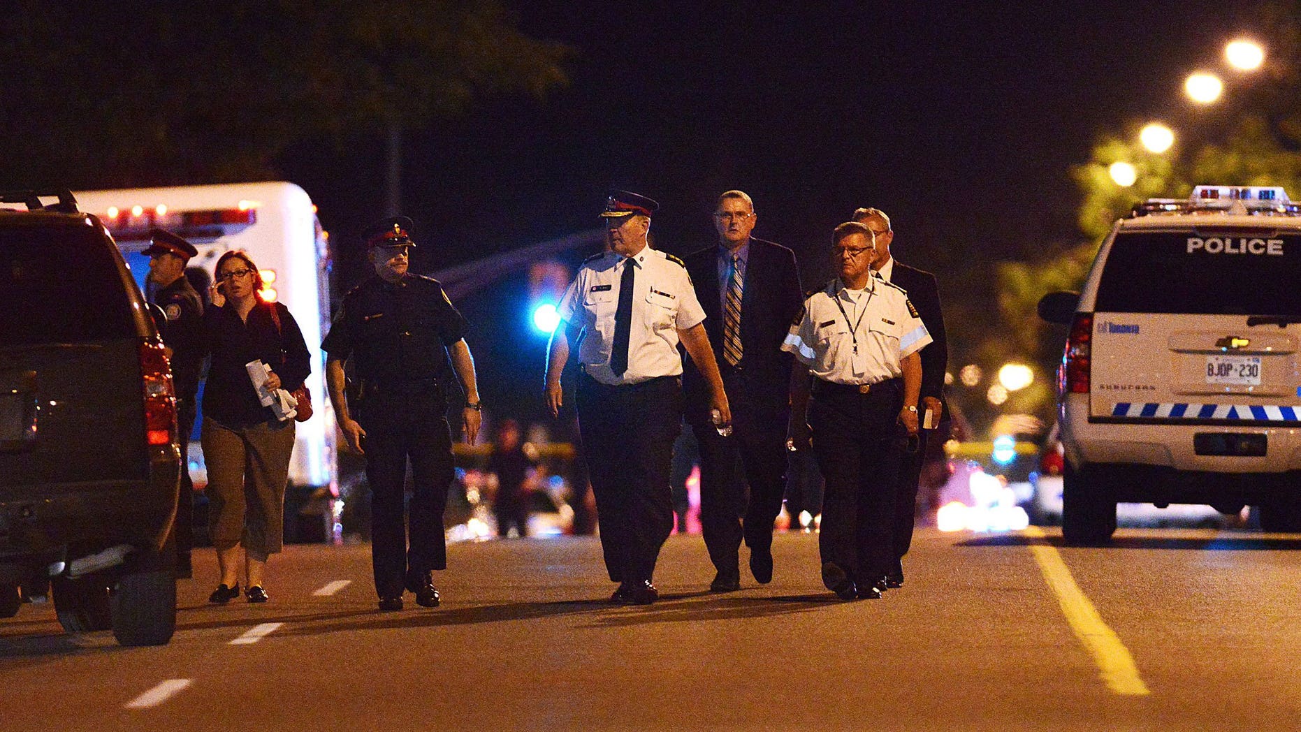 July 17, 2012: Toronto Police Chief Bill Blair walks down Morningside Ave. in Toronto following a shooting that left at least 19 people injured and two dead at a house party.