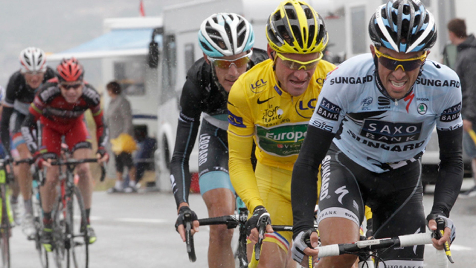 Saxo Bank rider Alberto Contador of Spain (R) cycles ahead of Europcar rider and race leader Thomas Voeckler of France (2nd R) and Leopard rider Andy Schleck of Luxembourg (C), BMC rider Cadel Evans of Australia (2L) and Leopard rider Frank Schleck of Luxembourg (L) during the 16th stage from Saint-Paul-Trois-Chateaux to Gap at the Tour de France 2011 cycling race July 19, 2011.