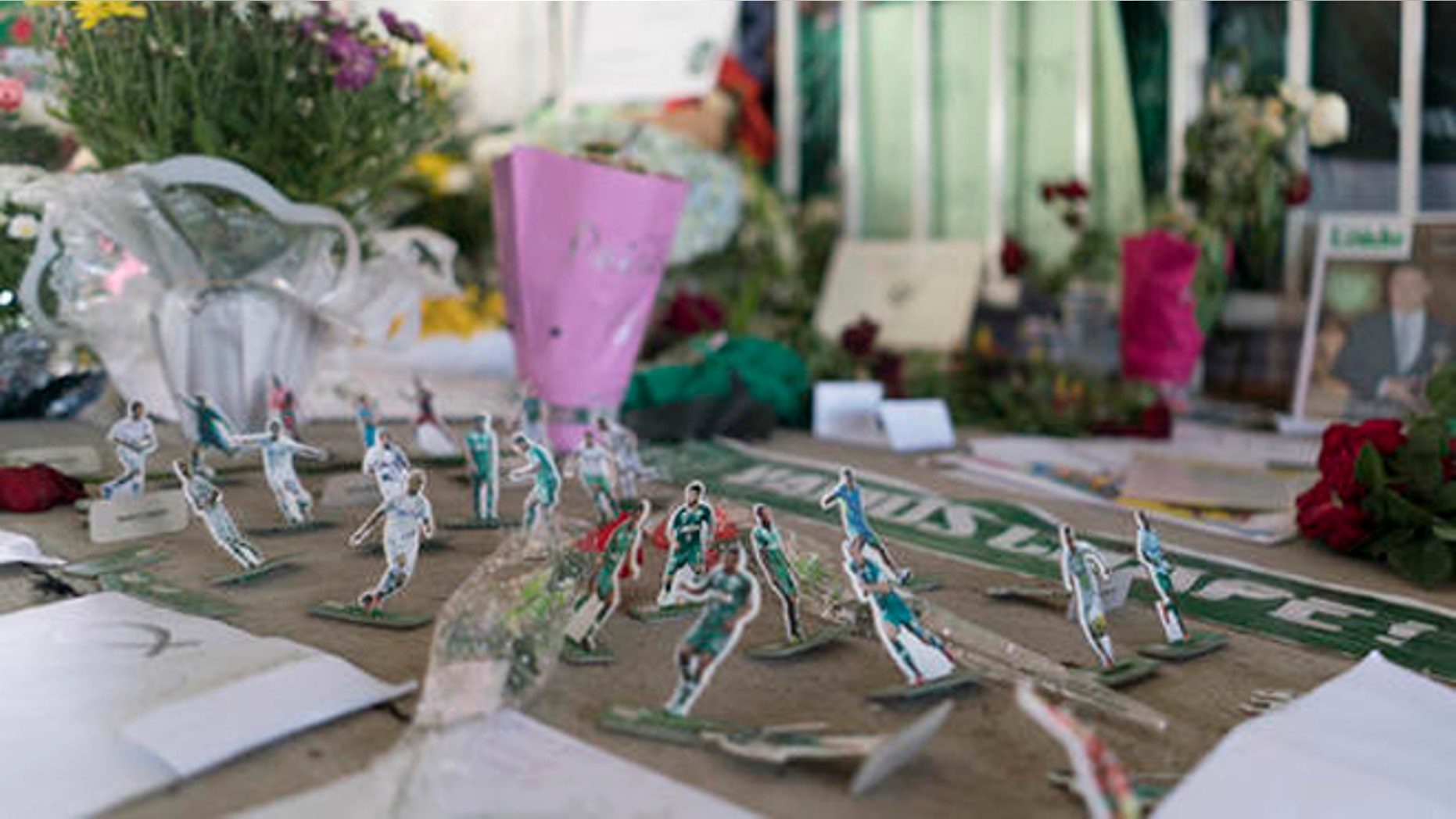 Miniature paper figures of Chapecoense soccer players adorn a makeshift memorial at the clubs stadium Conda Arena in Chapeco, Brazil, Friday, Dec. 2, 2016. The bodies of the Brazilian victims will be repatriated later Friday on three flights to Chapeco, the hometown of the Chapecoense Brazilian soccer team. Members of the team and a group of journalists who perished on the flight were headed to the Copa Sudamericana finals when the plane ran out of fuel, crashing into the Andes outside Medellin. (AP Photo/Renata Brito)