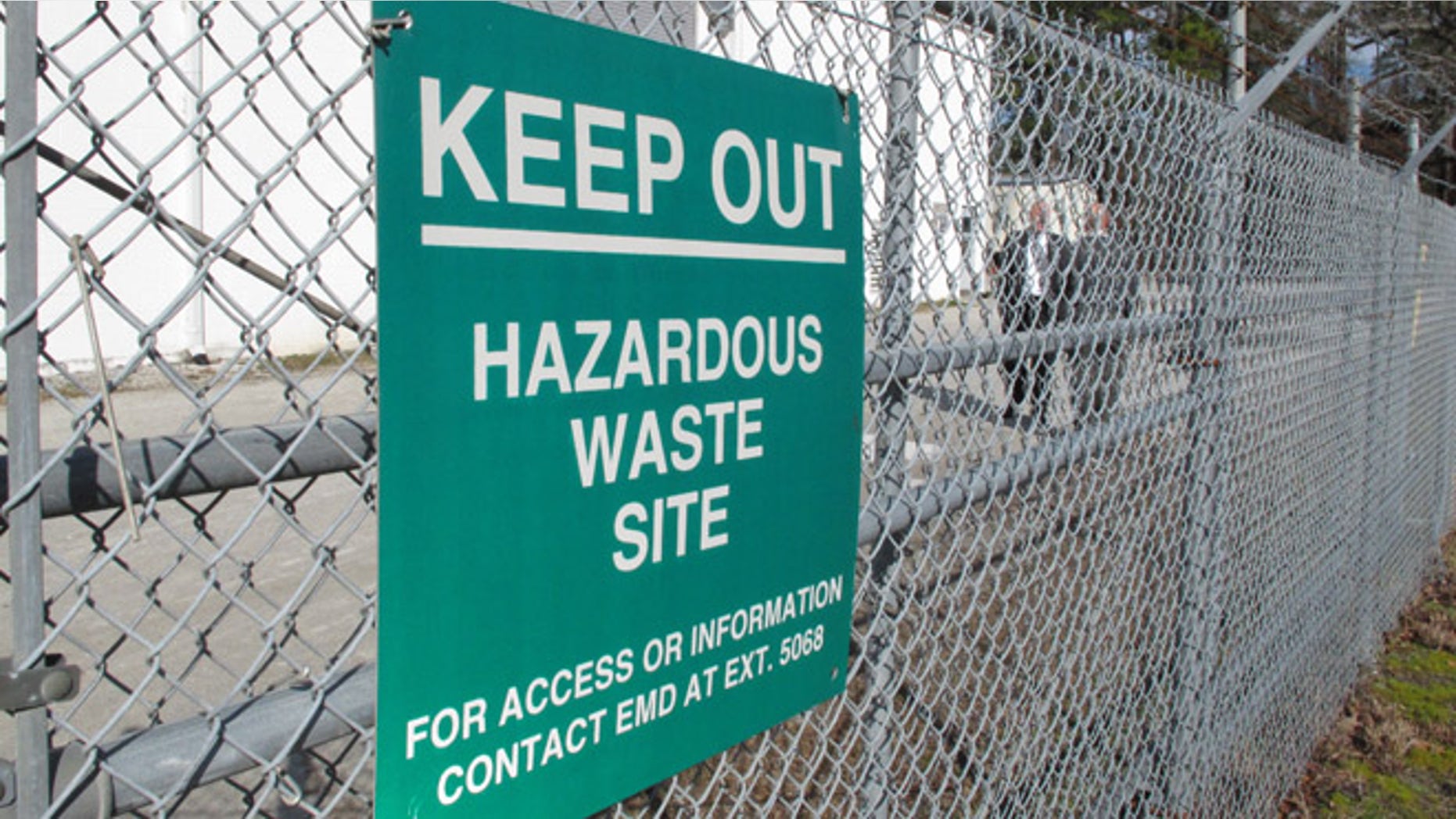 A sign cautions visitors outside a "pump and treat" facility on the Marine base at Camp Lejeune, N.C., on Wednesday, Feb. 27, 2013. The sprawling installation is the site of one of the worst drinking water contaminations in U.S. history.