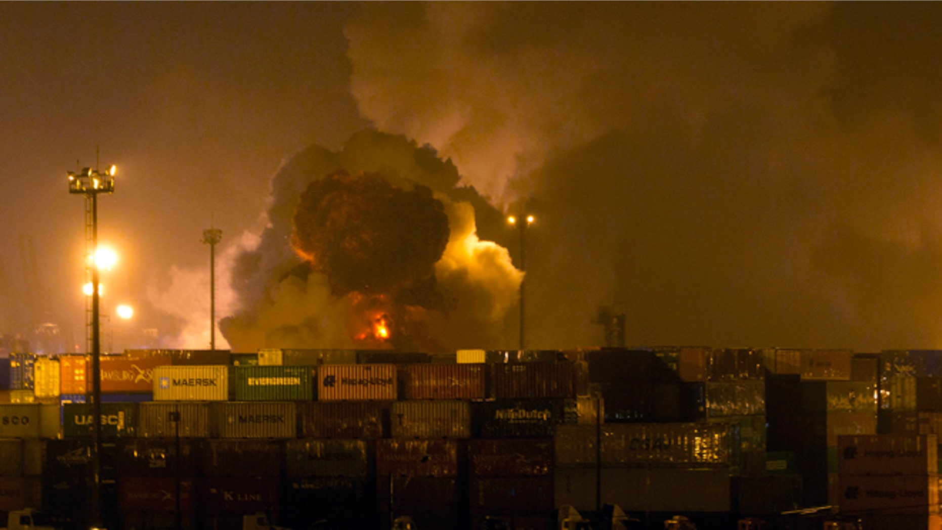 Smoke rises from a tank at a warehouse in the coastal city of Guaruja, Brazil, Thursday, Jan. 14, 2016.