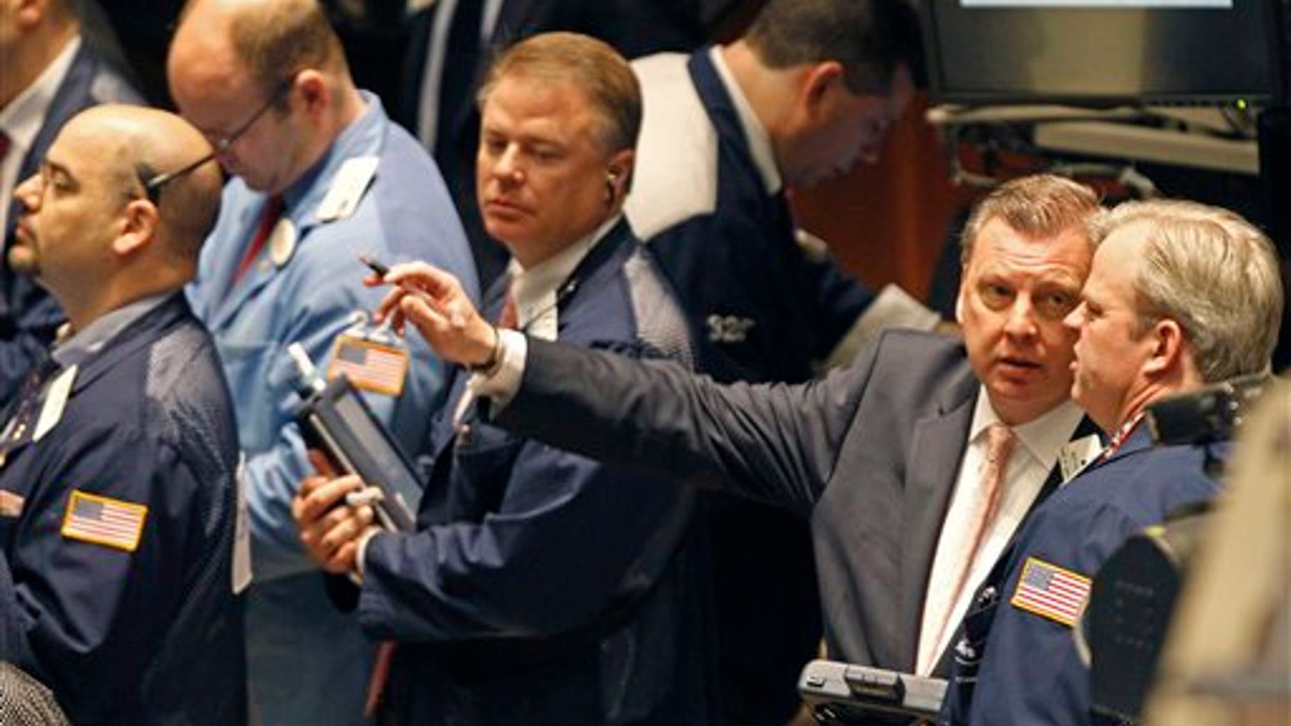 April 19: Traders work on the floor of the New York Stock Exchange.