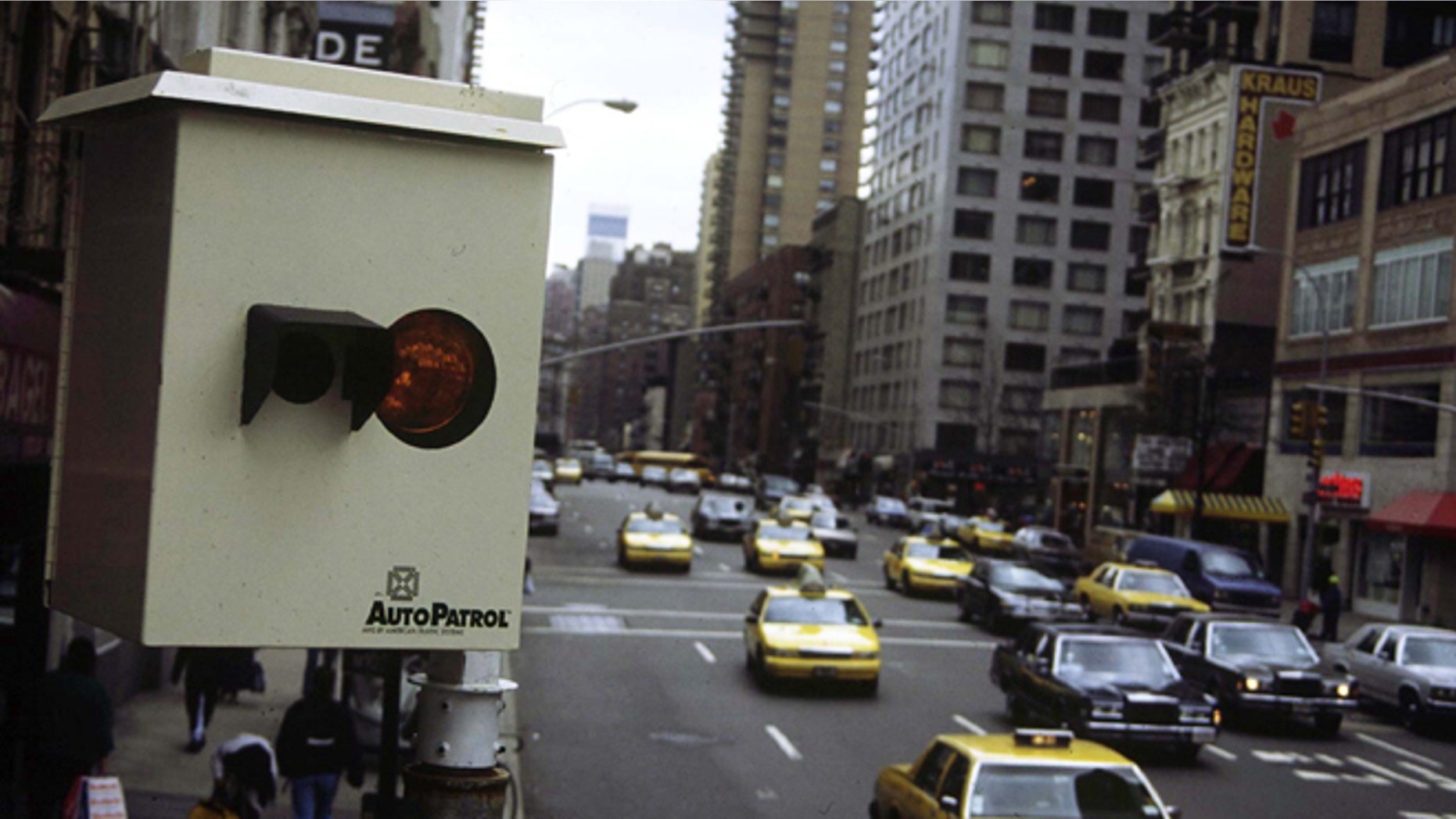 FILE: Undated: A red light camera above a city street in the United States.