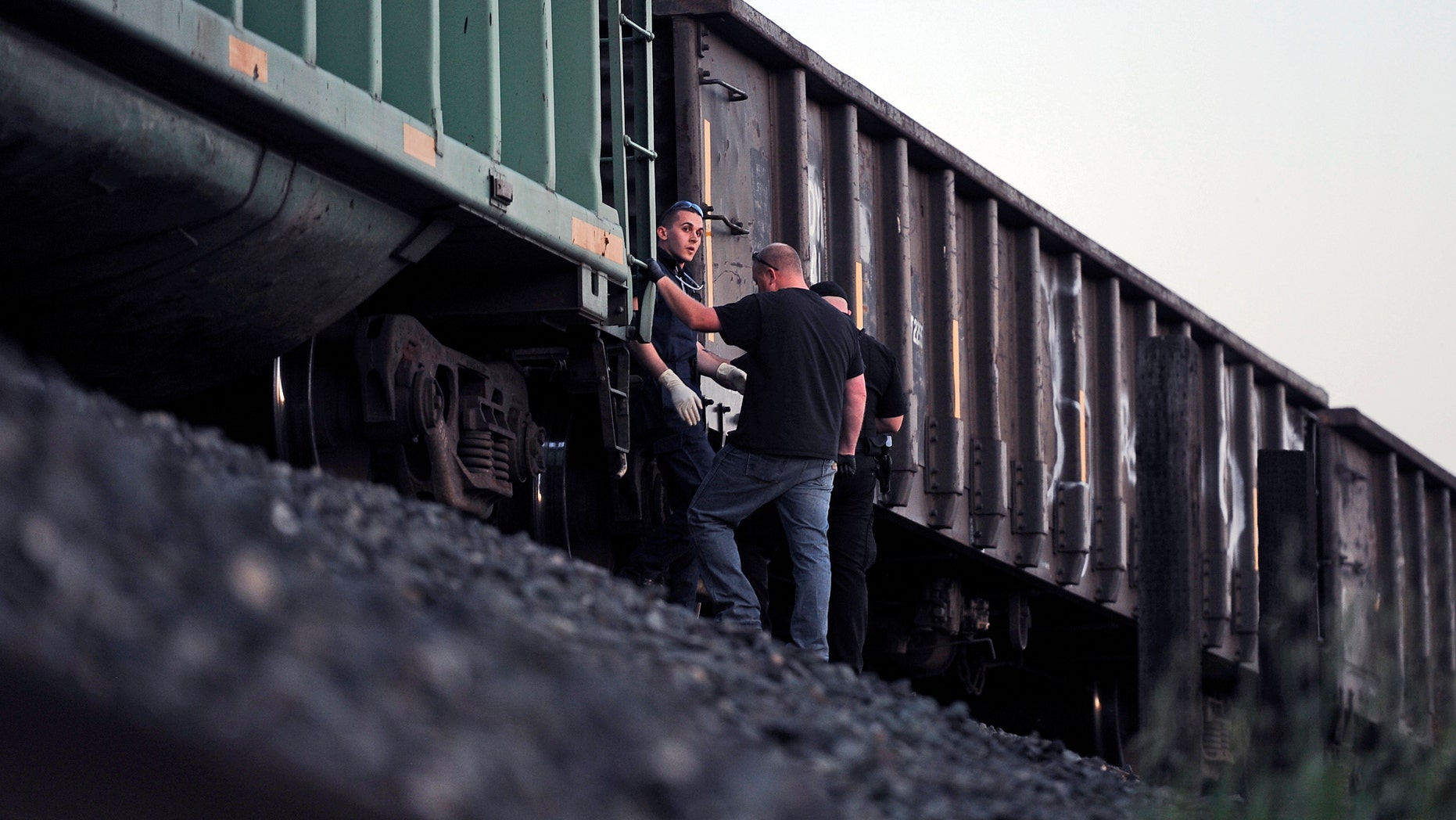 March 21, 2014: Emergency personnel work at the scene of a train accident where two pedestrians were hit near Earle Yorton Field in Marysville, Calif.
