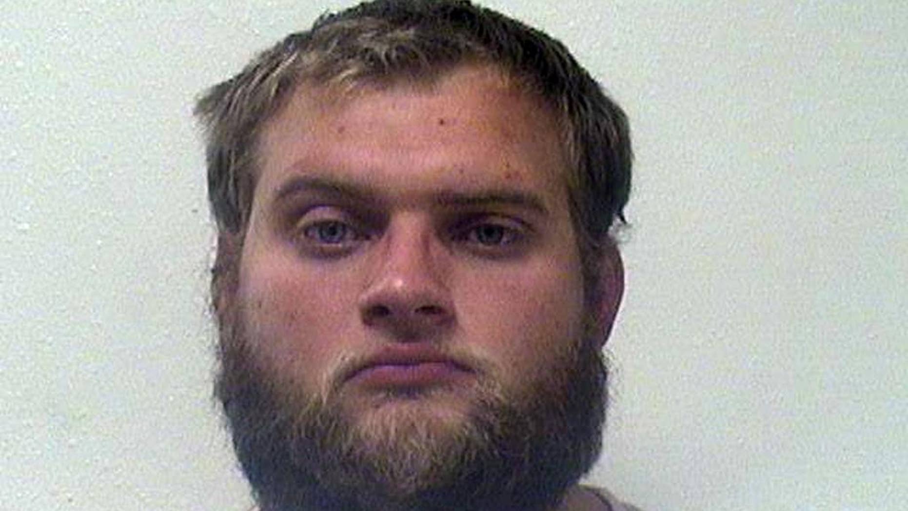 This photo provided by the Campbell County Sheriff's Office shows Derek Skyler Brux, who pleaded guilty to a federal charge in connection with taking two locomotives from a coal mine and crashing them into another train last fall. He faces sentencing Friday, April 10, 2015. (AP Photo/Campbell County Sheriff's Office)