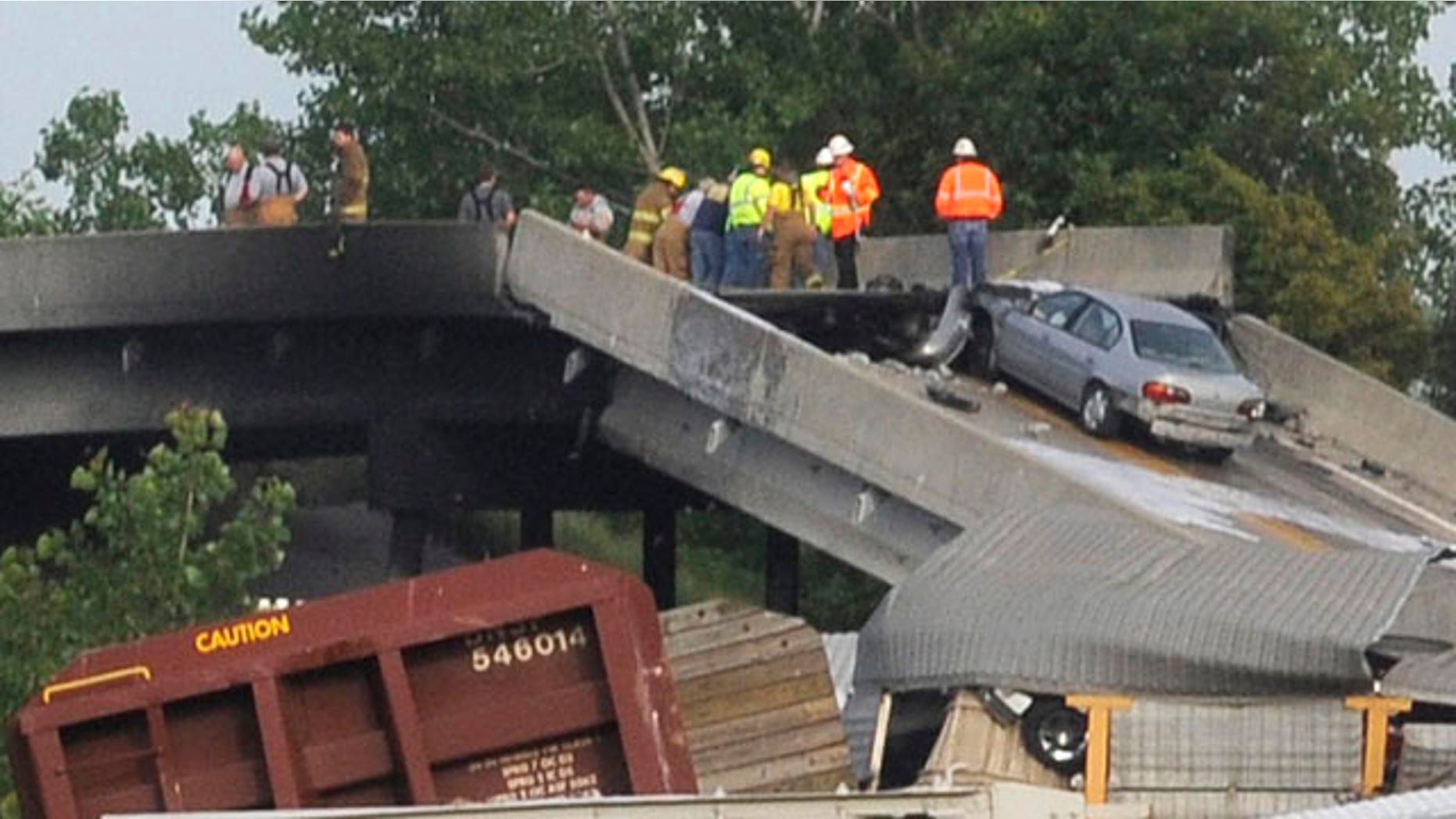 May 25, 2013: Emergency personnel respond to the scene of a train derailment near Rockview, Mo.