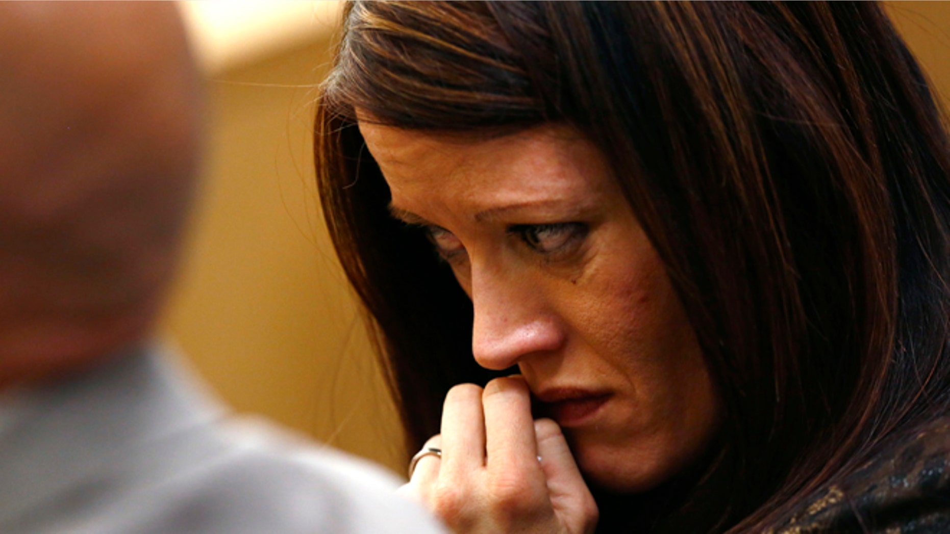 May 15, 2013: Tanisha Sorenso turns away as autopsy photos of her brother Travis Alexander are displayed during the sentencing phase of the Jodi Arias murder trial at Maricopa County Superior Court in Phoenix.