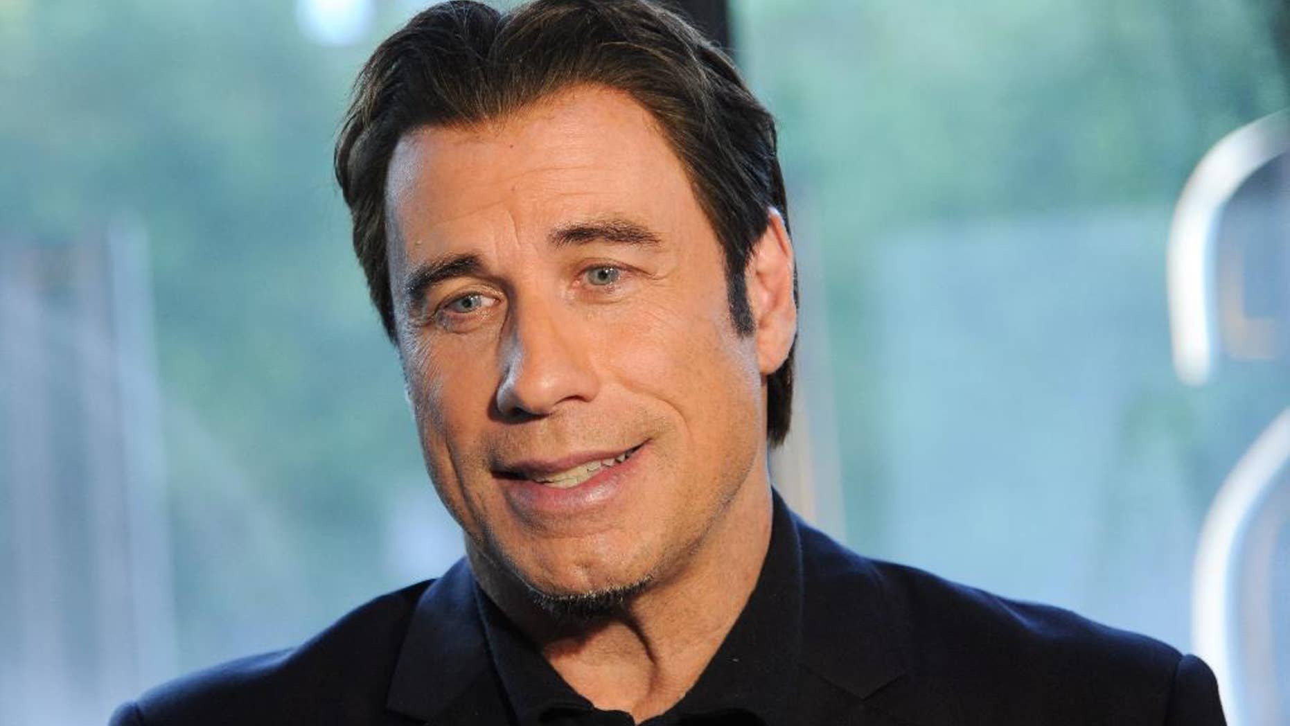 FILE - Actor John Travolta attends a special screening of "Killing Season" hosted by Jagermeister at the Sunshine Landmark Theater in this Thursday, June 20, 2013 file photo taken in New York. (Photo by Evan Agostini/Invision/AP)