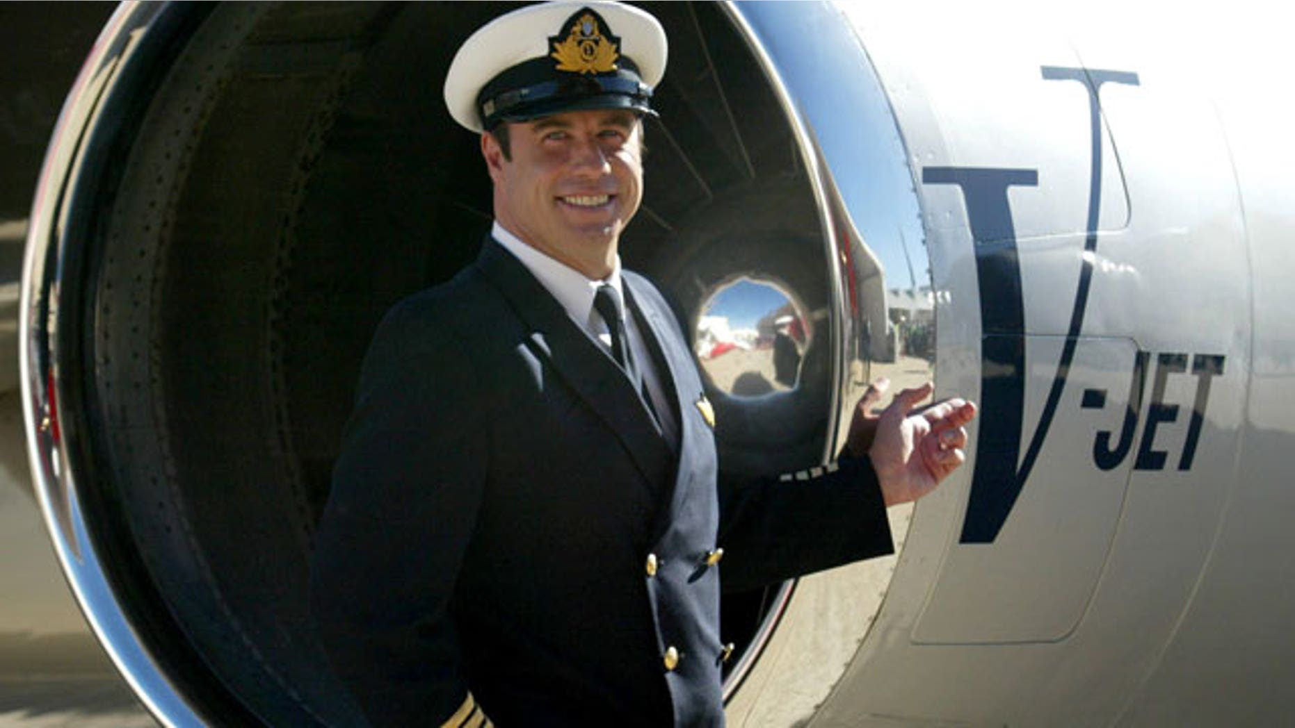 FILE: John Travolta, shown in front of his jet in 2002.
