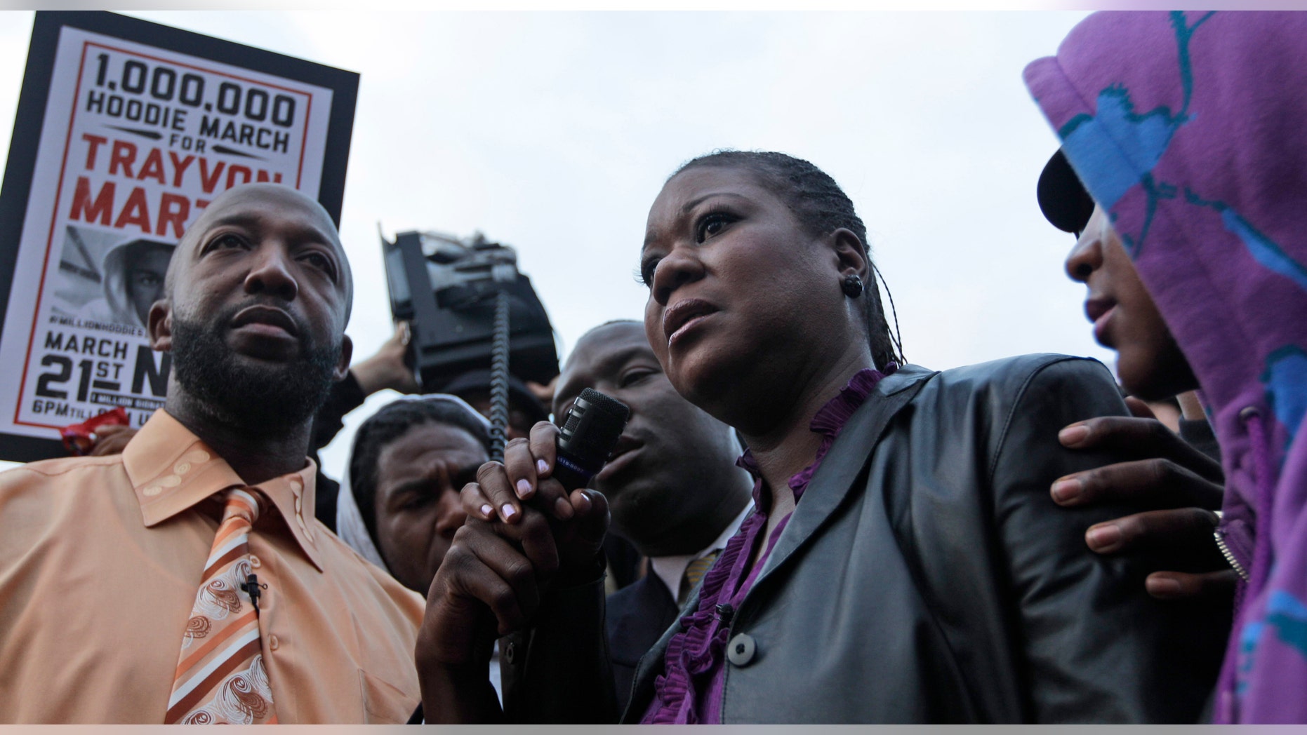March 21, 2012: Trayvon Martin's parent's Tracy Martin, left, and Sybrina Fulton, center, take part in the Million Hoodie March in Union Square in New York. (AP/Mary Altaffer)