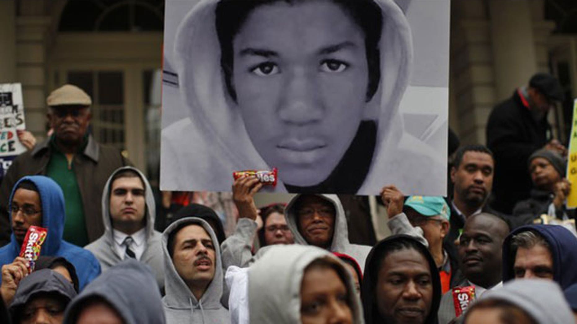 March 28, 2012: Members of the New York City Council wear "hoodie" sweatshirts as they stand together on the steps of City Hall in New York.