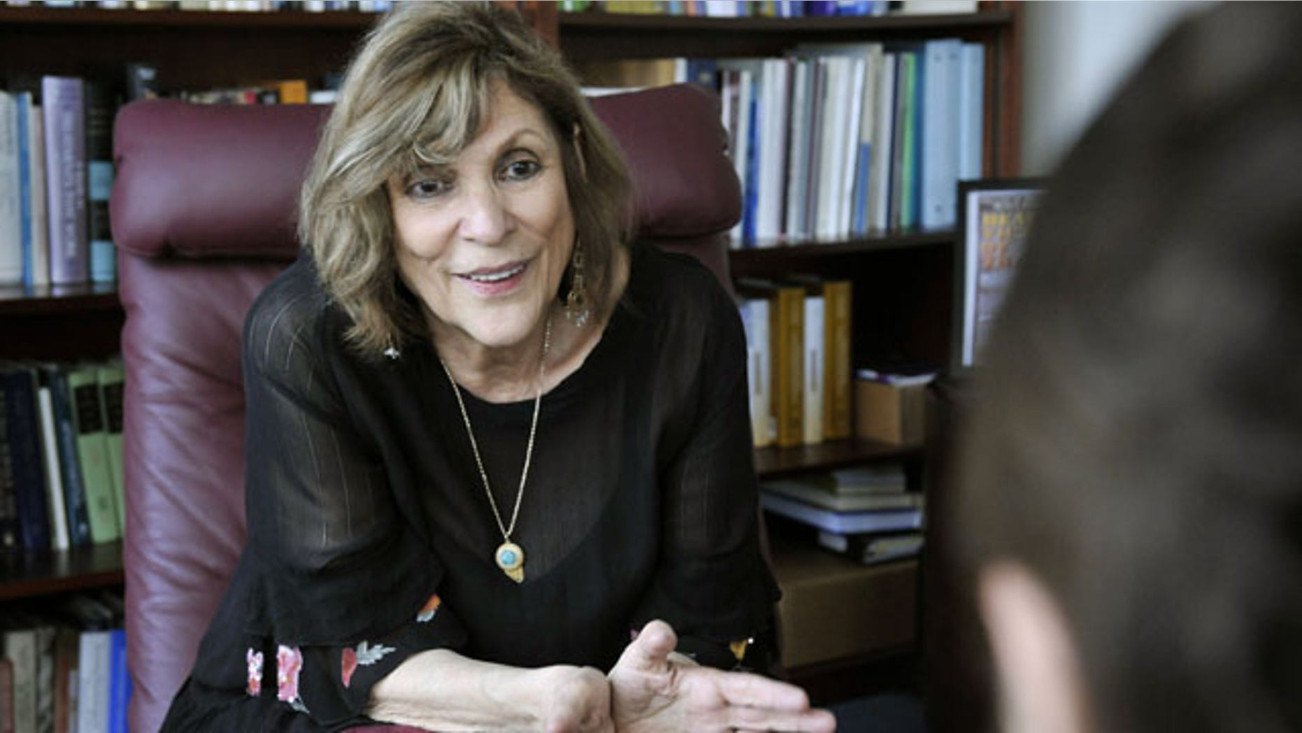 In this April 2010 photo provided by the University of Pennsylvania, Edna Foa, from the Perelman School of Medicine at the University of Pennsylvania, speaks to a patient at her office in Philadelphia. Foa developed a two-part treatment in which patients sexually abused patients tell their traumatic stories over and over again. (AP/University of Pennsylvania)