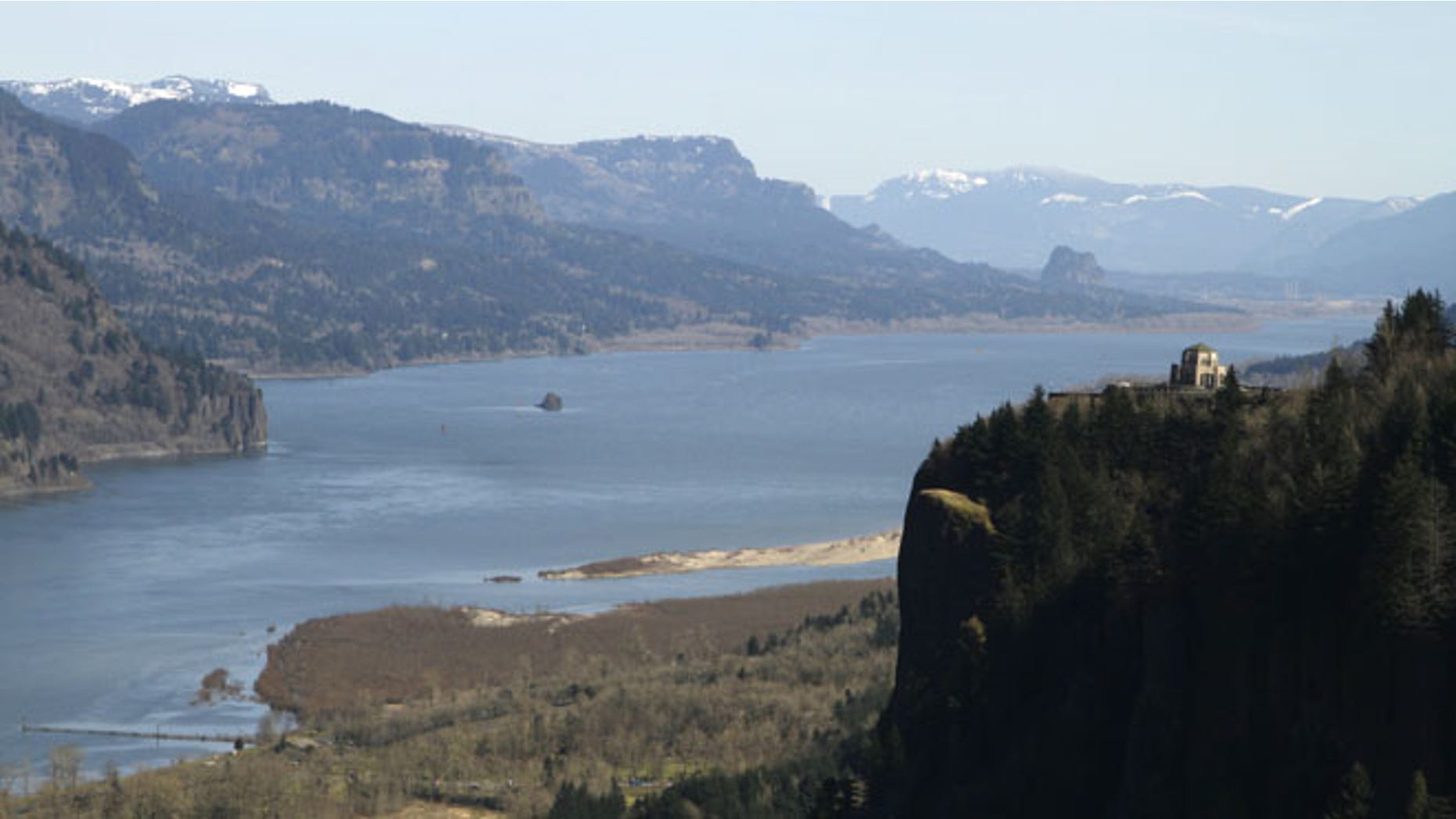 March 7, 2012: In this file photo, the Columbia River flows past the Vista House on Crown Point at right near Corbett, Ore.