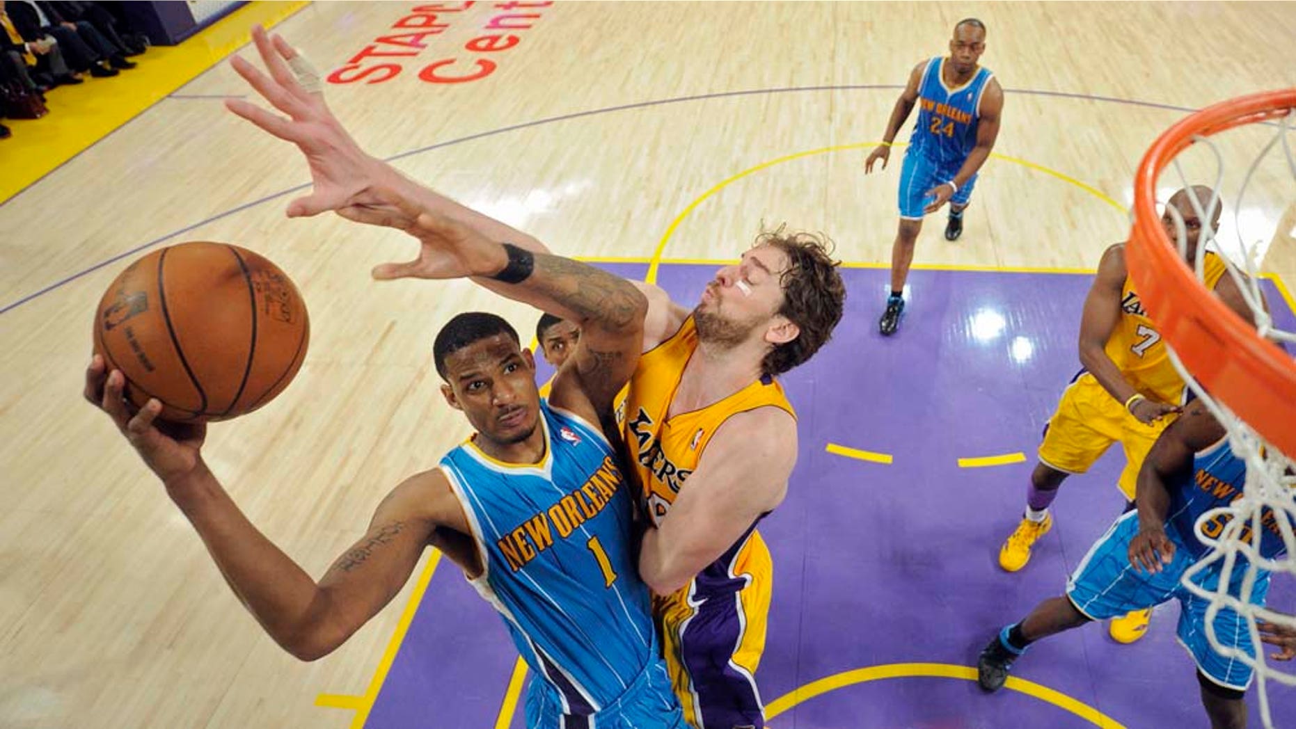 New Orleans Hornets forward Trevor Ariza, left, puts up a shot as Los Angeles Lakers forward Pau Gasol of Spain defends during the second half in Game 2 of a first-round NBA basketball playoff series, Wednesday, April 20, 2011, in Los Angeles. The Lakers won 87-78. (AP Photo/Mark J. Terrill)
