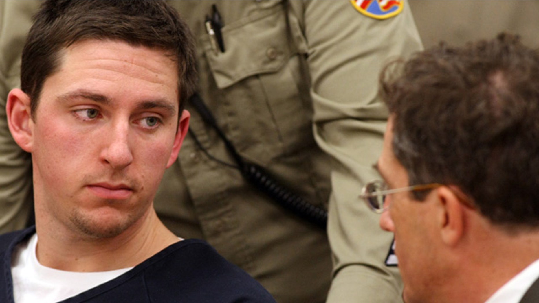 FILE January 2009: Johannes Mehserle, left, talks with his attorney Christopher Miller in the East Fork Justice Court in Minden, Nev.