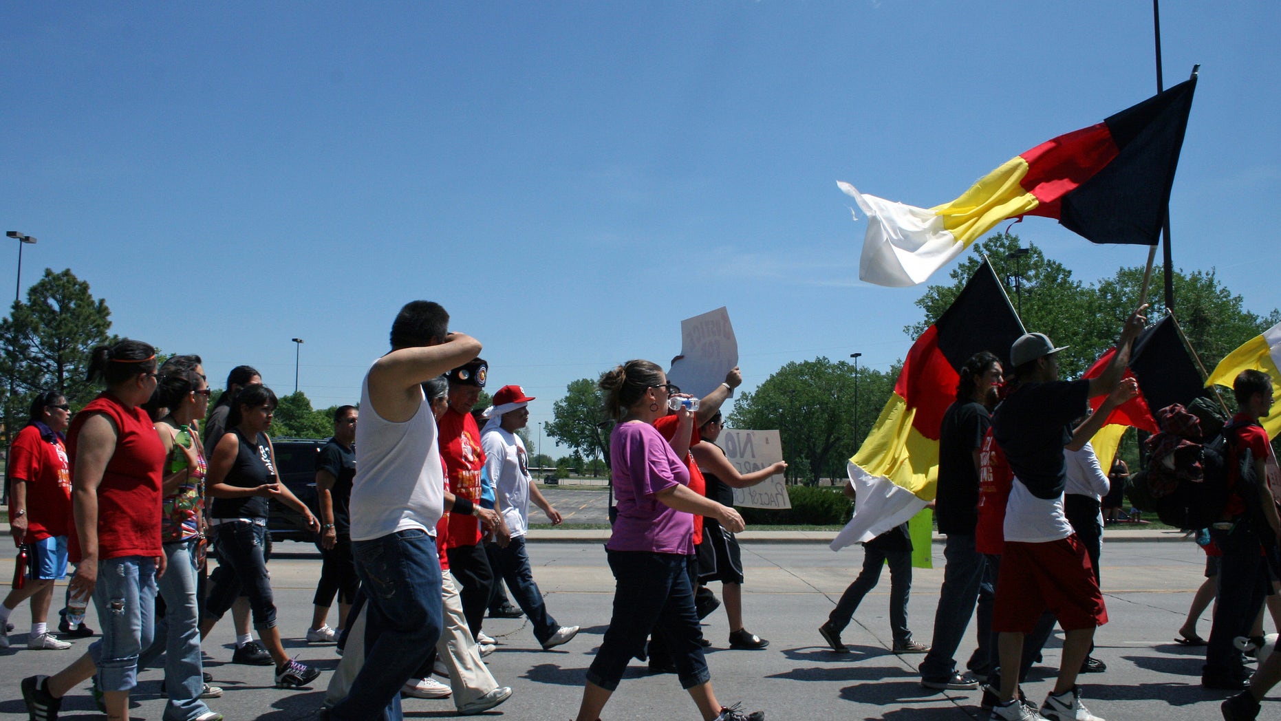 Hundreds of people march in support of a man who says the letters KKK were carved into his stomach while undergoing surgery at Rapid City Regional Hospital in S.D.. (AP Photo/Kristi Eaton)