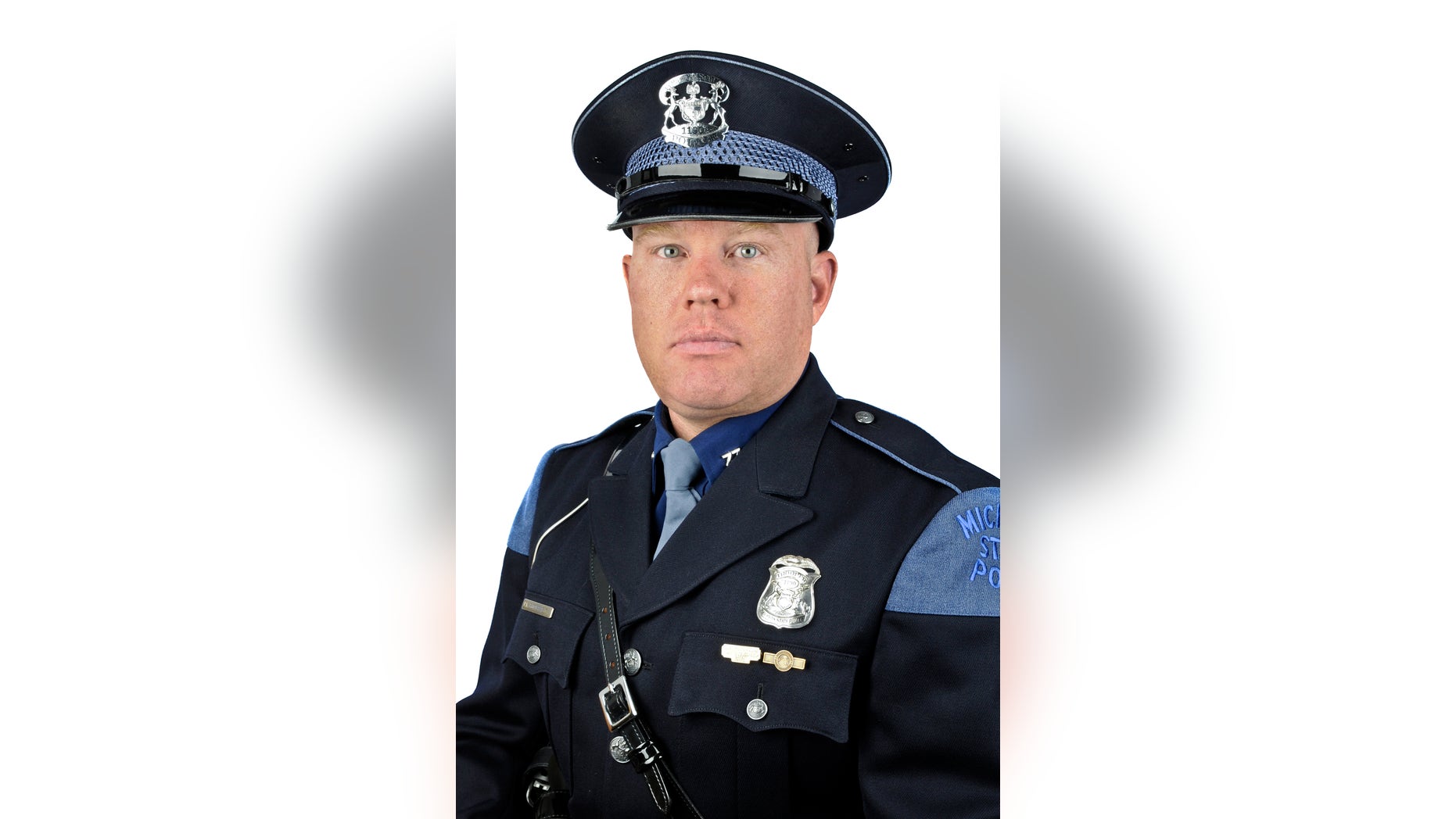In this Aug. 8, 2011 photo released by the Michigan State Police, Trooper Paul Butterfield of the Hart post is shown. Butterfield was fatally shot in Mason County on Monday, Sept. 9, 2013.