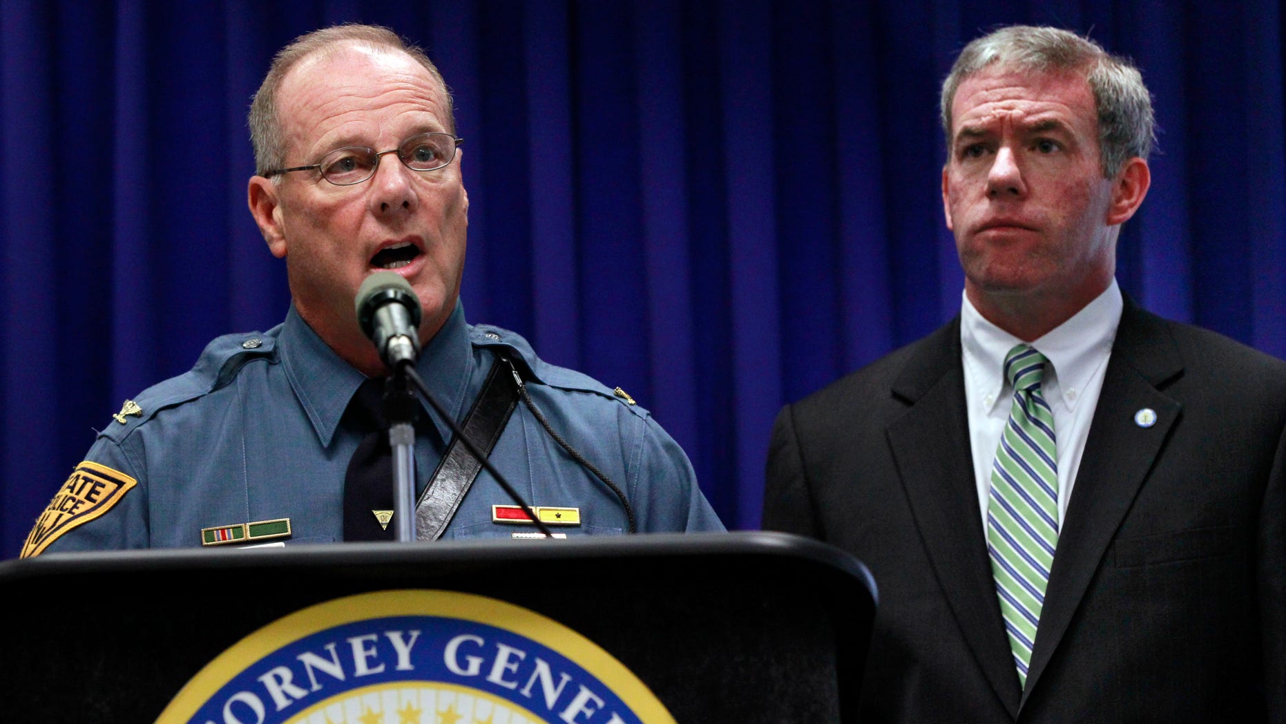 July 27, 2012: New Jersey Attorney General Jeffrey S. Chiesa, right, looks on as State Police Superintendent Colonel Rick Fuentes answers a in Trenton, N.J.