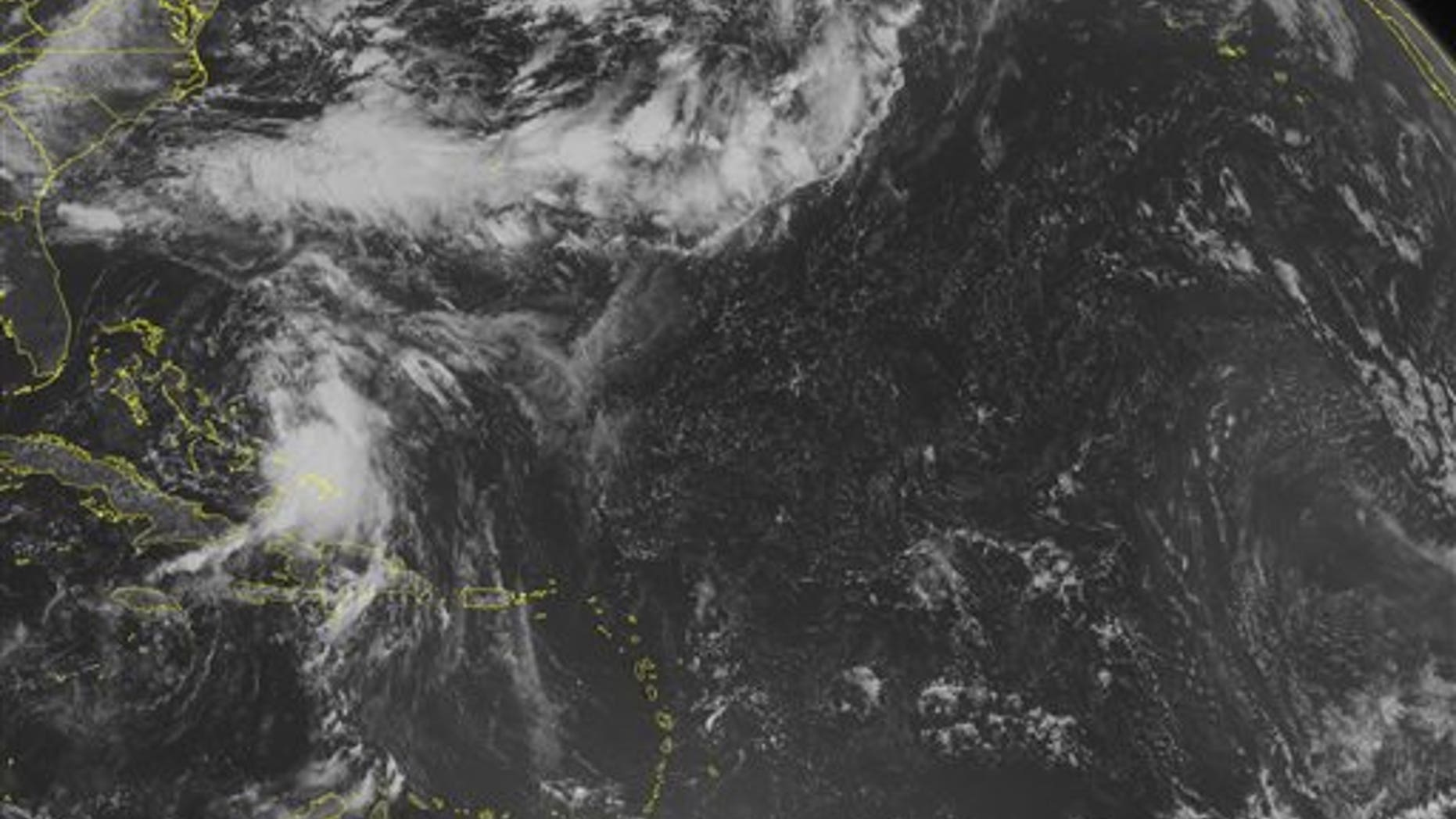 This NOAA satellite image taken Sunday, Aug. 24, 2014 at 10:45 AM EDT shows Tropical Storm Cristobal moving northward across the Bahamas, as a dense area of clouds with heavy rain and gusty winds. A band 0f clouds present across Bermuda to the Southeast US is associated with a frontal boundary. More scattered clouds are present across Hispaniola and eastern Cuba into the eastern Caribbean Basin. (AP PHOTO/WEATHER UNDERGROUND)