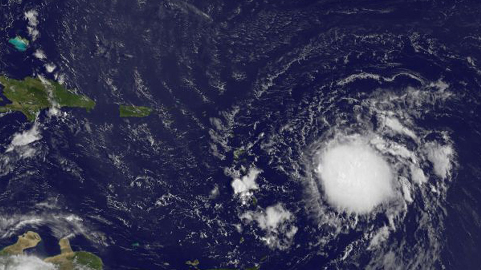 Tropical Storm Erika is pictured in the Atlantic Ocean northeast of Venezuela in this August 26, 2015 NASA handout satellite photo.