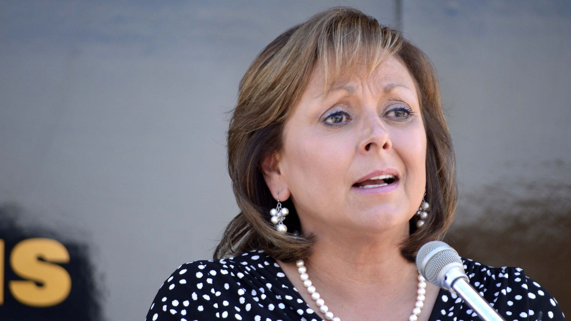 New Mexico Gov. Susana Martinez speaks about new laws expanding the state's Amber Alert and fighting child prostitution Wednesday, July 1, 2015, at a New Mexico Police State station in Albuquerque N.M. The nation's only Latina governor denounced fellow Republican and GOP presidential hopeful Donald Trump for his comments about Mexican immigrants. (AP Photo/Russell Contreras)