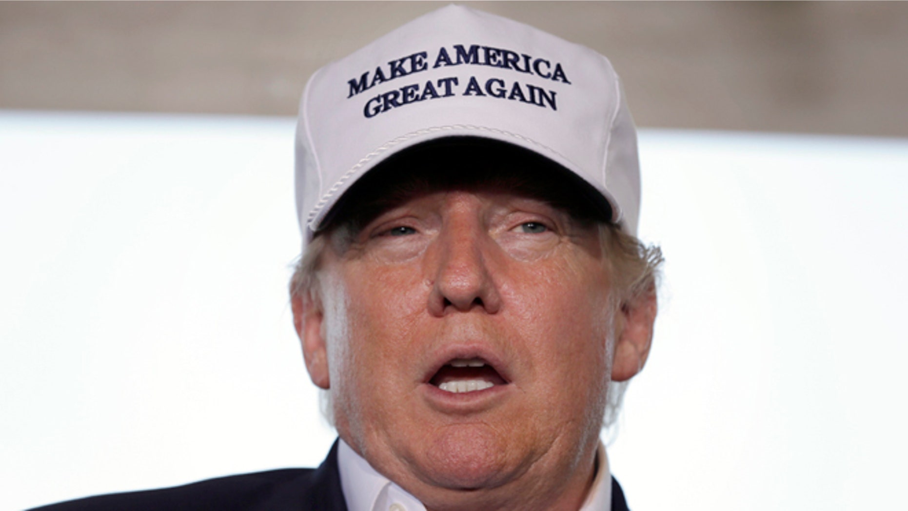 Republican presidential hopeful Donald Trump speaks to the media during a tour of the the World Trade International Bridge at the U.S. Mexico border in Laredo, Texas, Thursday, July 23, 2015. Trump predicted Hispanics would love him, "they already do," because as president he'd grab jobs back from overseas and give more opportunity to those who live in the U.S. legally. (AP Photo/LM Otero)