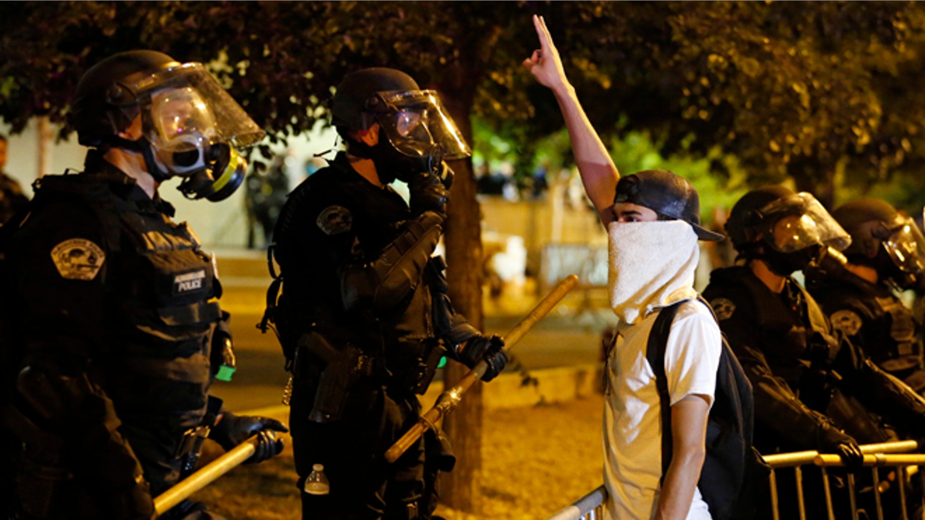 Riot police block off the Albuquerque Convention Center to anti-Trump protests Tuesday, May 24, 2016.