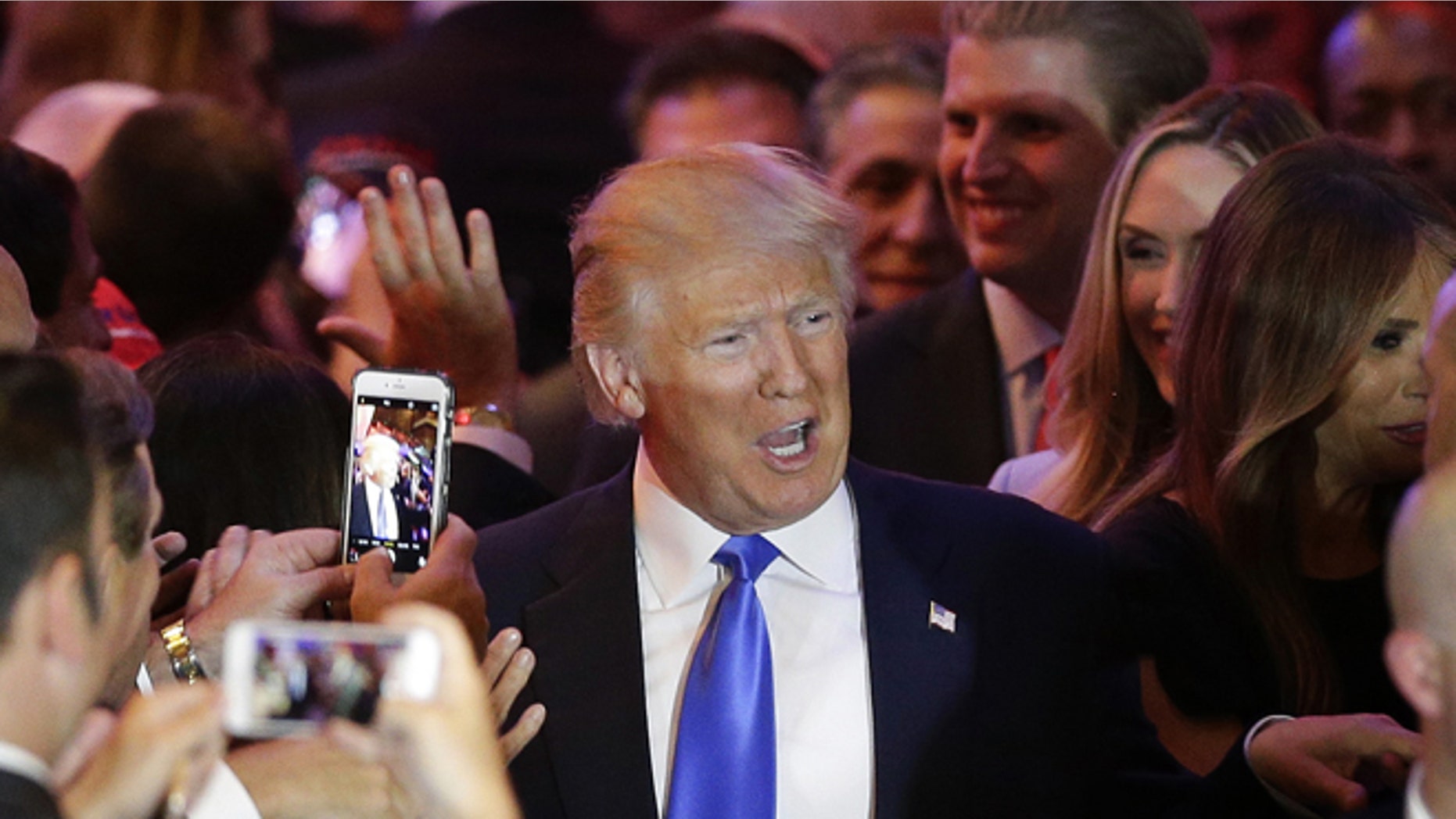 Republican presidential candidate Donald Trump makes his way along a line of supporters before speaking during a primary night news conference, Tuesday, April 26, 2016, in New York. (AP Photo/Julie Jacobson)