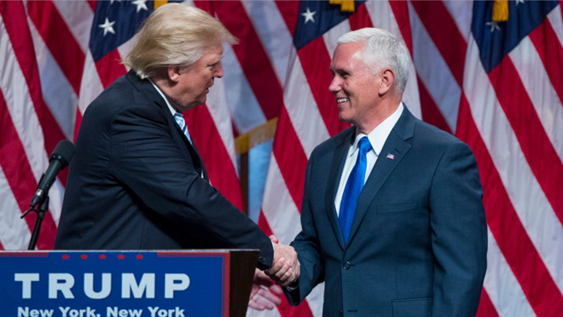 Republican presidential candidate Donald Trump, right, introduces Gov. Mike Pence, R-Ind., during a campaign event to announce Pence as the vice presidential running mate on, Saturday, July 16, 2016, in New York. (AP Photo/Evan Vucci)